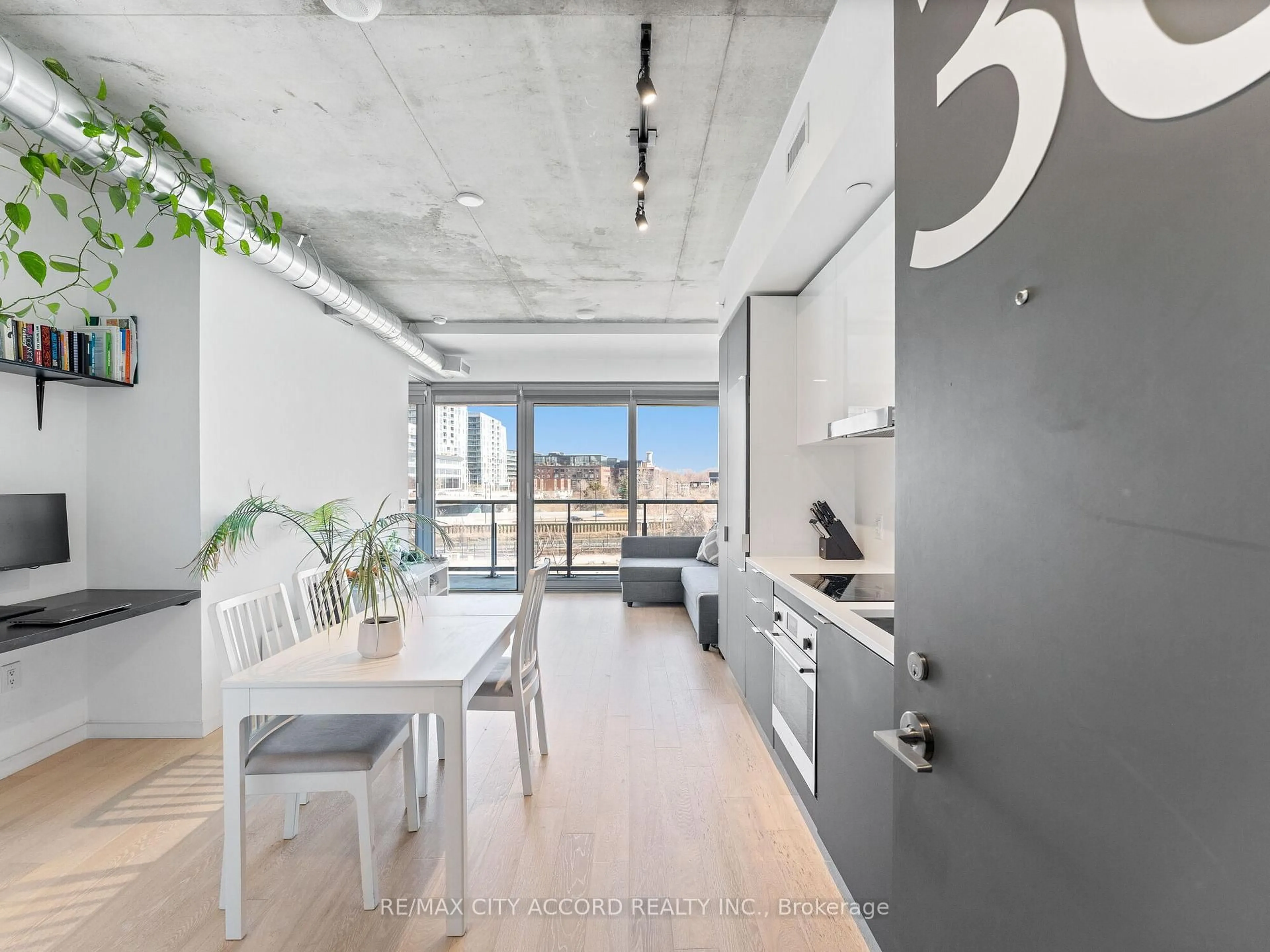 Open concept kitchen, cement floor for 170 Bayview Ave #305, Toronto Ontario M5A 0M4