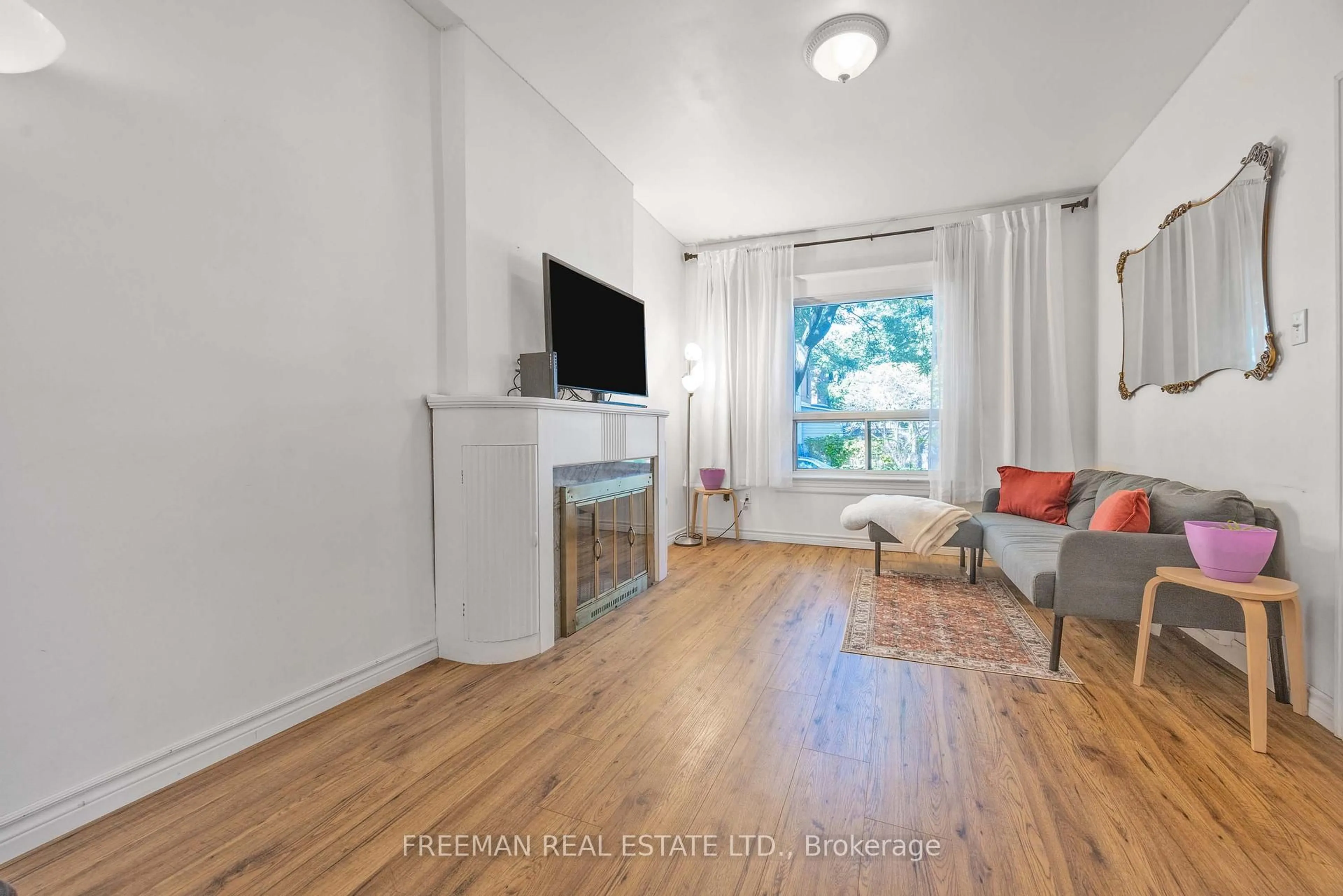 Living room with furniture, wood/laminate floor for 21 London St, Toronto Ontario M6G 1M8