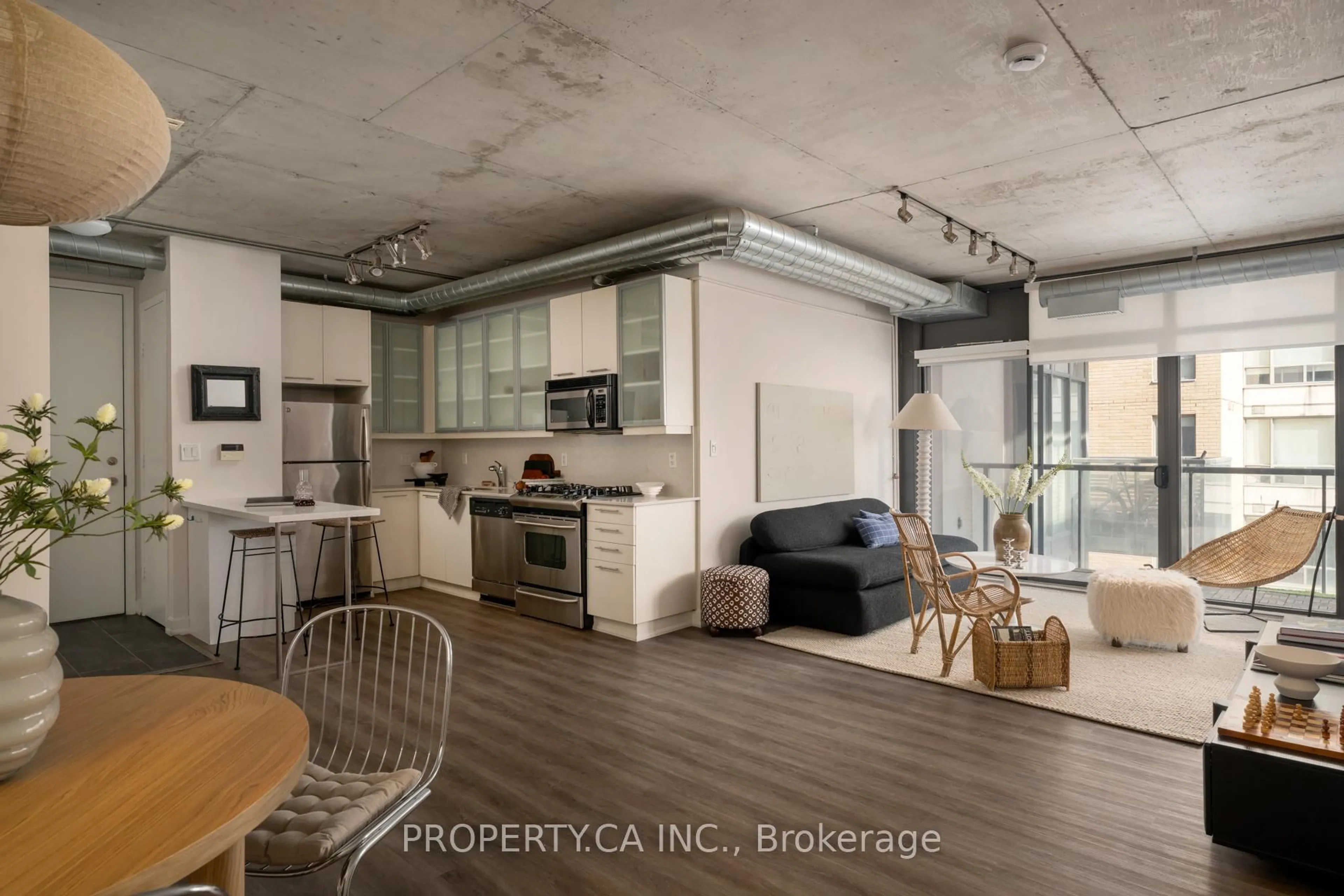 Open concept kitchen, cement floor for 533 Richmond St #505, Toronto Ontario M5V 3Y1