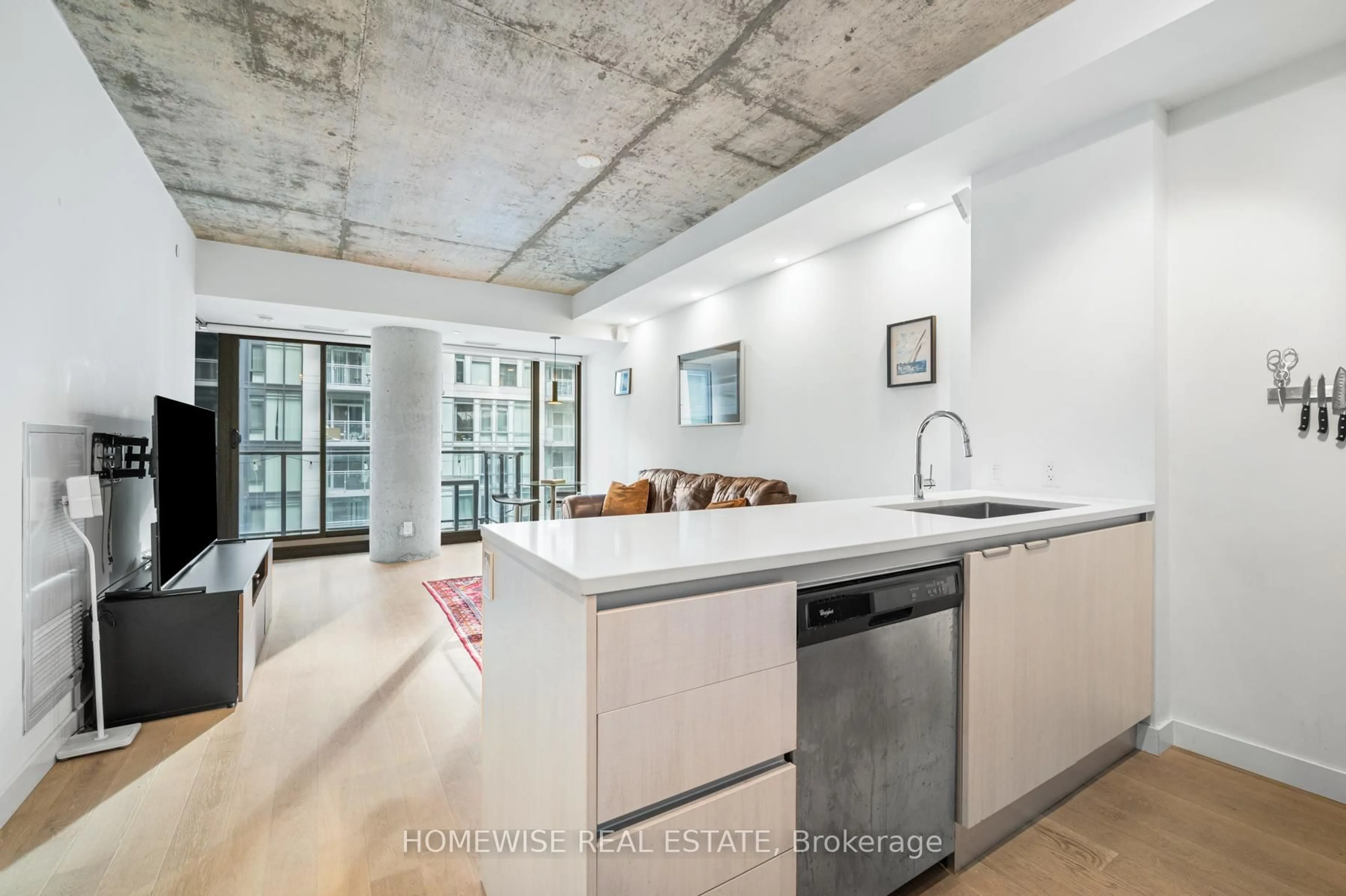 Open concept kitchen, cement floor for 111 Bathurst St #1009, Toronto Ontario M5V 2R1