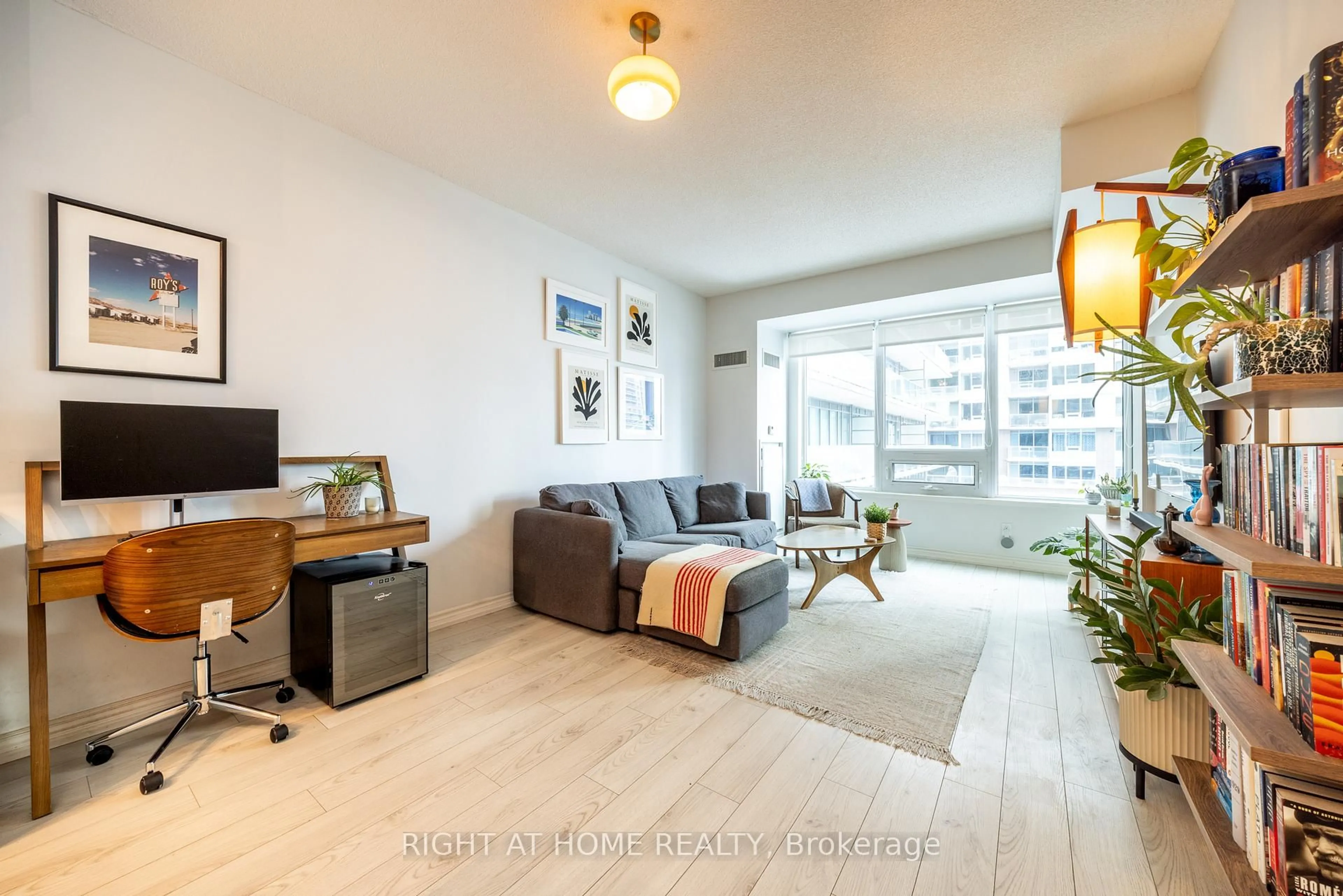 Living room with furniture, wood/laminate floor for 55 East Liberty St #615, Toronto Ontario M6K 3P9