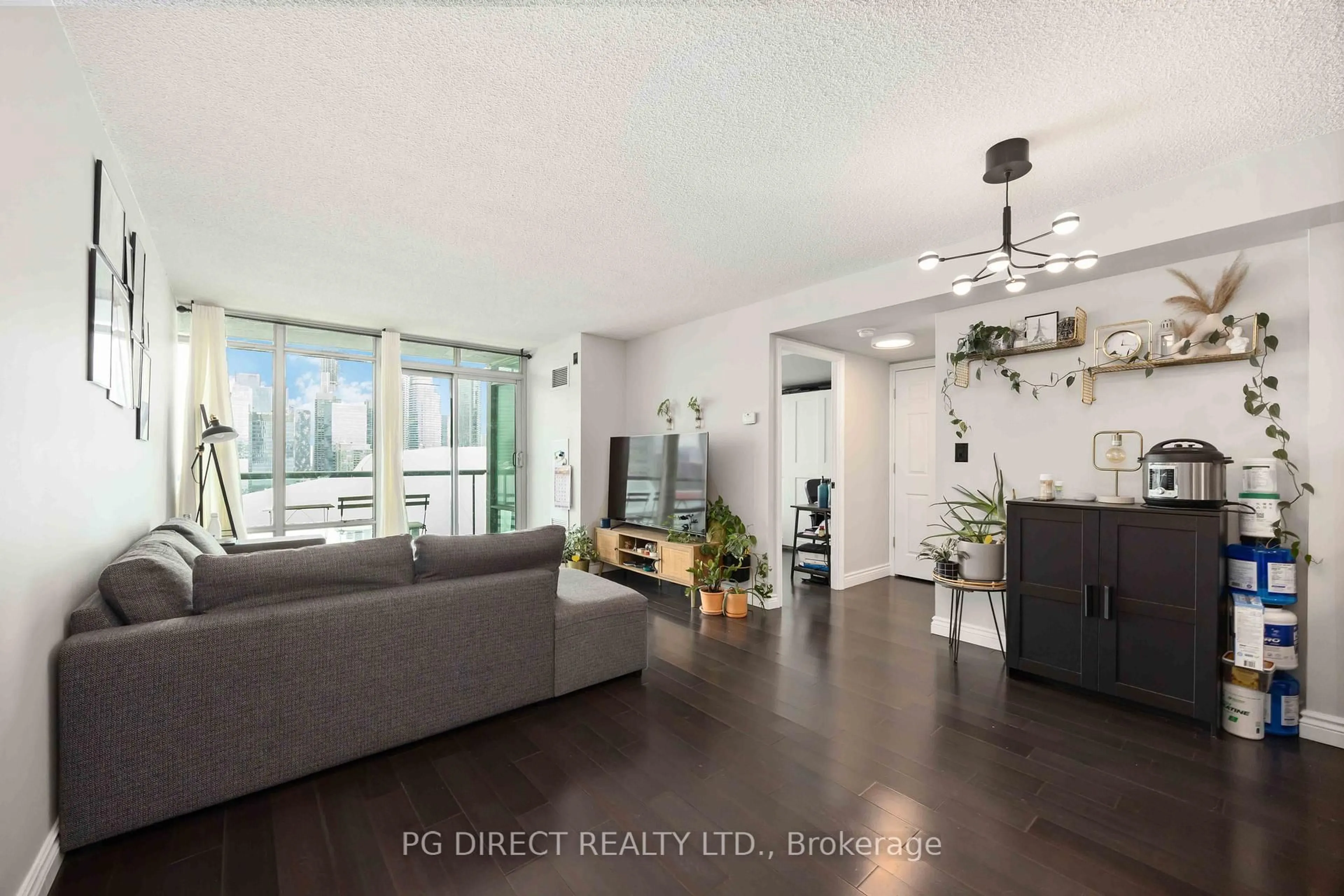 Living room with furniture, wood/laminate floor for 81 Navy Wharf Crt #3502, Toronto Ontario M5V 3S2