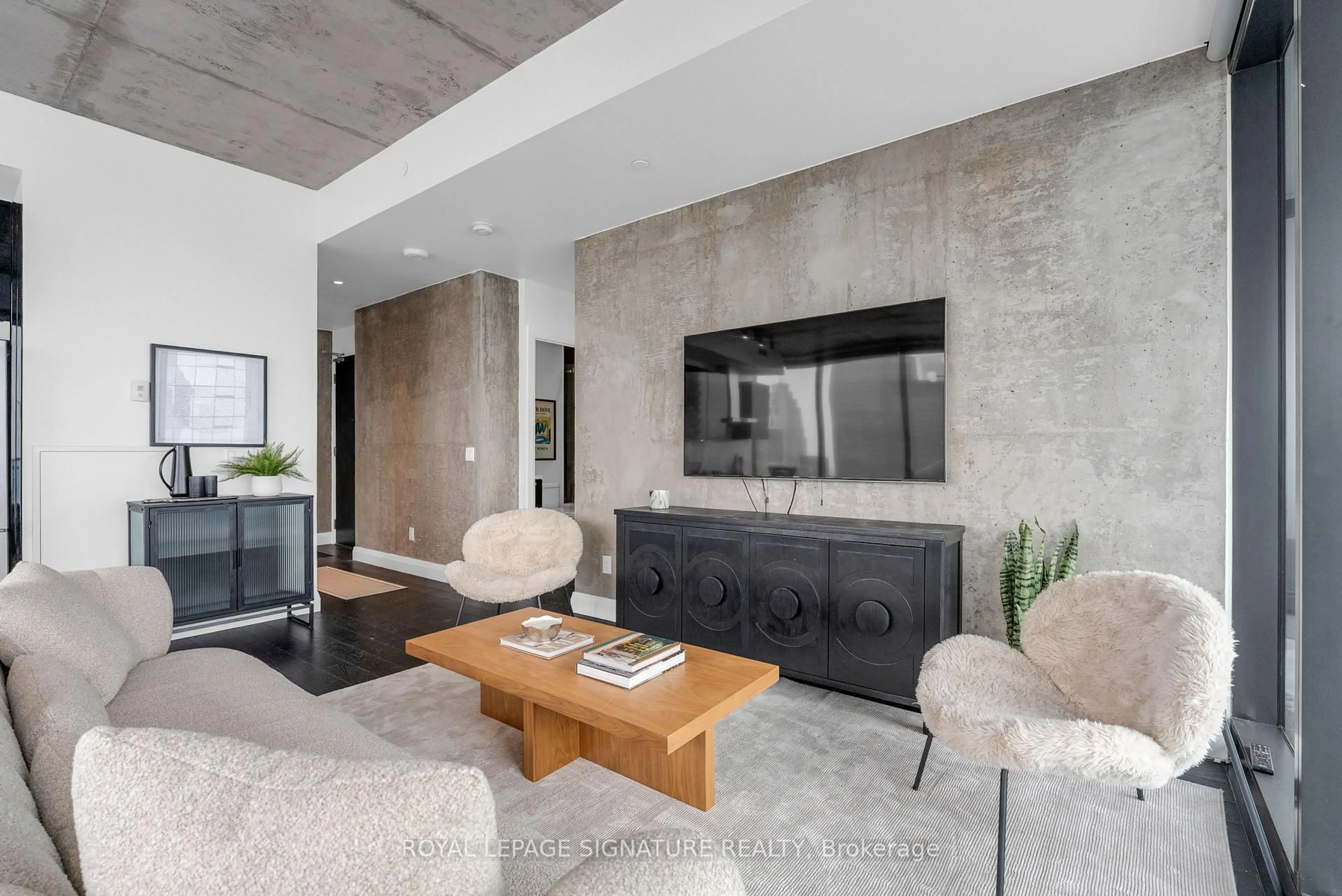 Living room with furniture, cement floor for 224 King St #4002, Toronto Ontario M5V 1H8