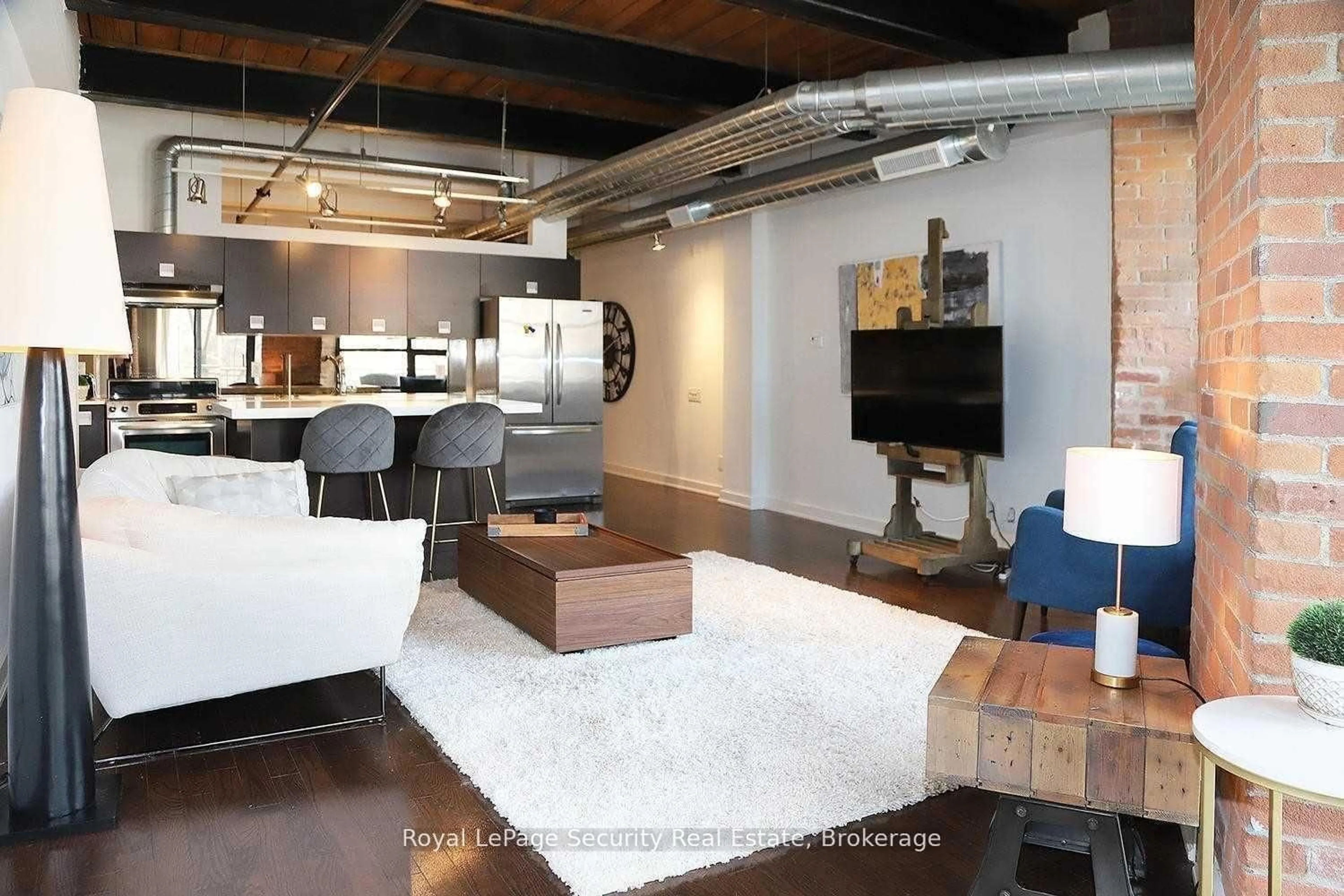 Living room with furniture, unknown for 43 Hanna Ave #208, Toronto Ontario M6K 1X1