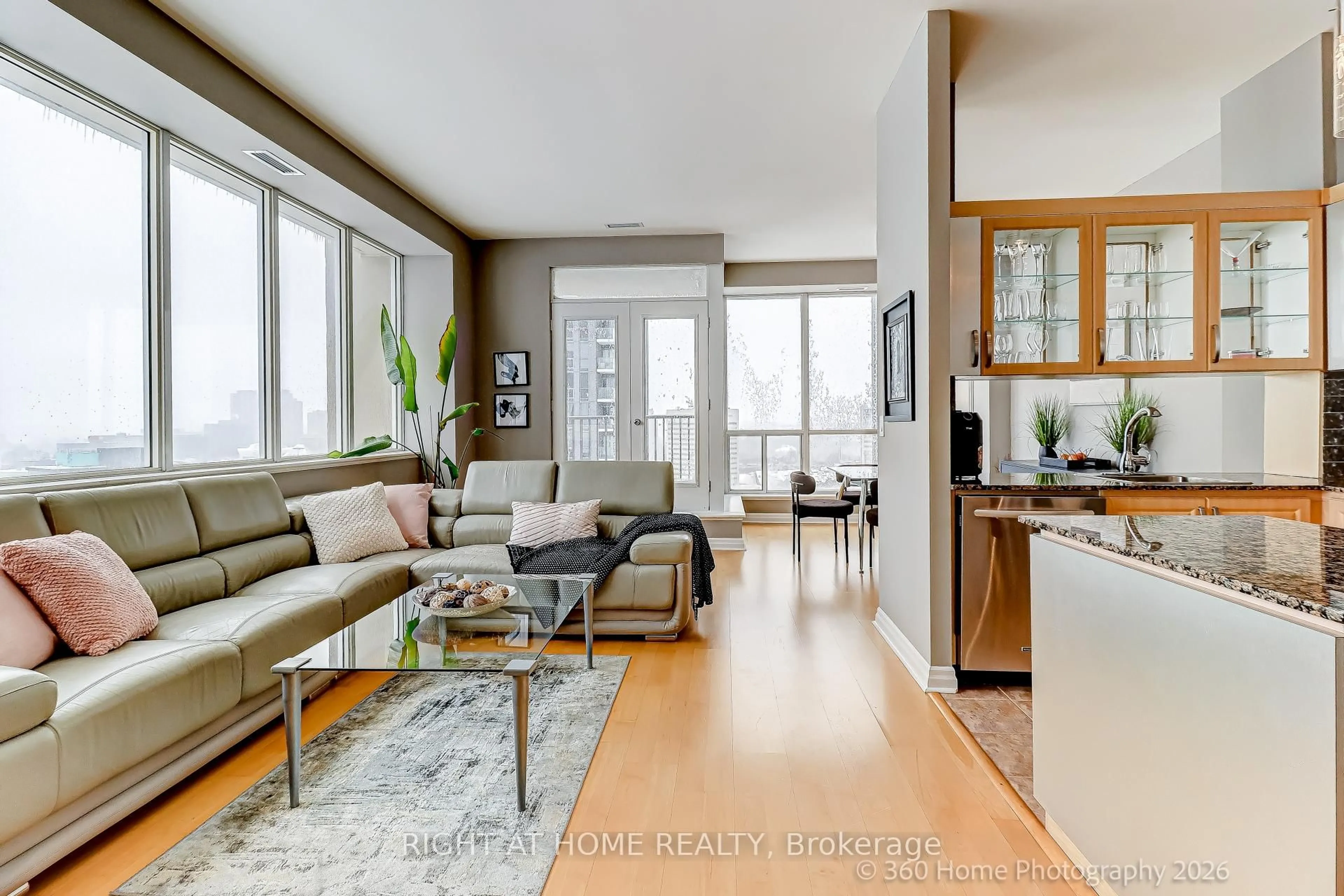 Living room with furniture, wood/laminate floor for 797 Don Mills Rd #1408, Toronto Ontario M3C 1V1