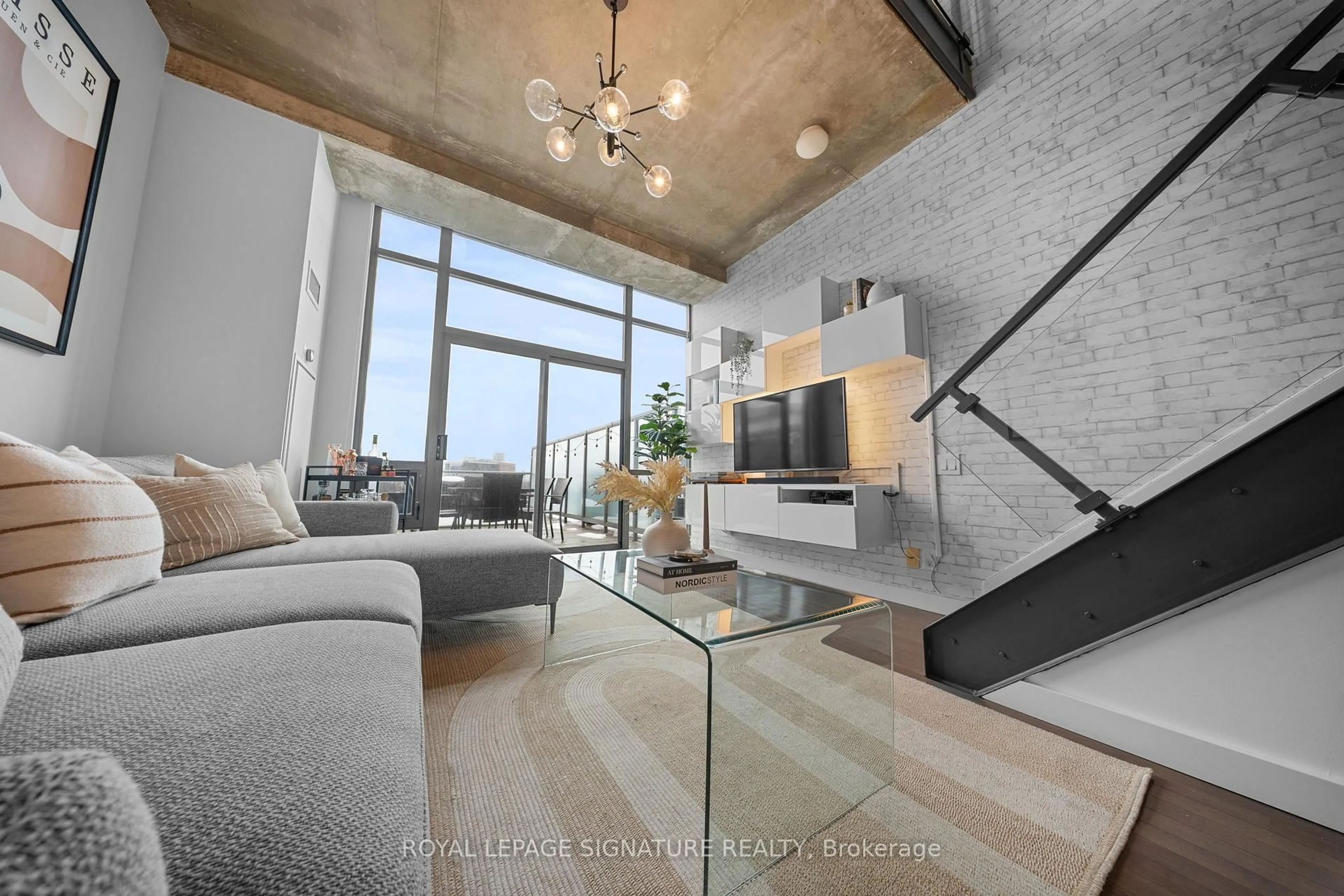 Living room with furniture, cement floor for 33 Mill St #606, Toronto Ontario M5A 3R3