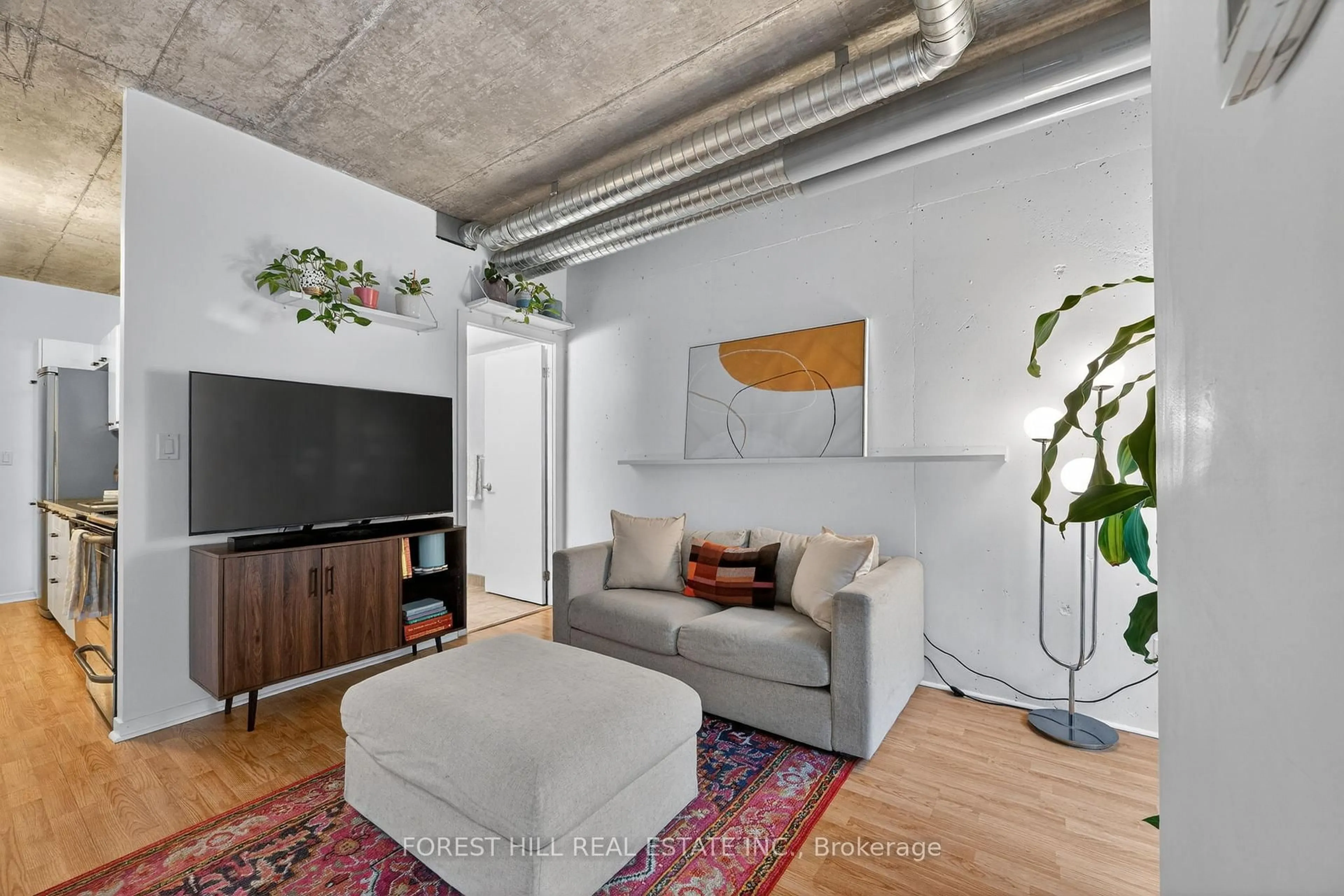 Living room with furniture, cement floor for 150 Sudbury St #1308, Toronto Ontario M6J 3S8