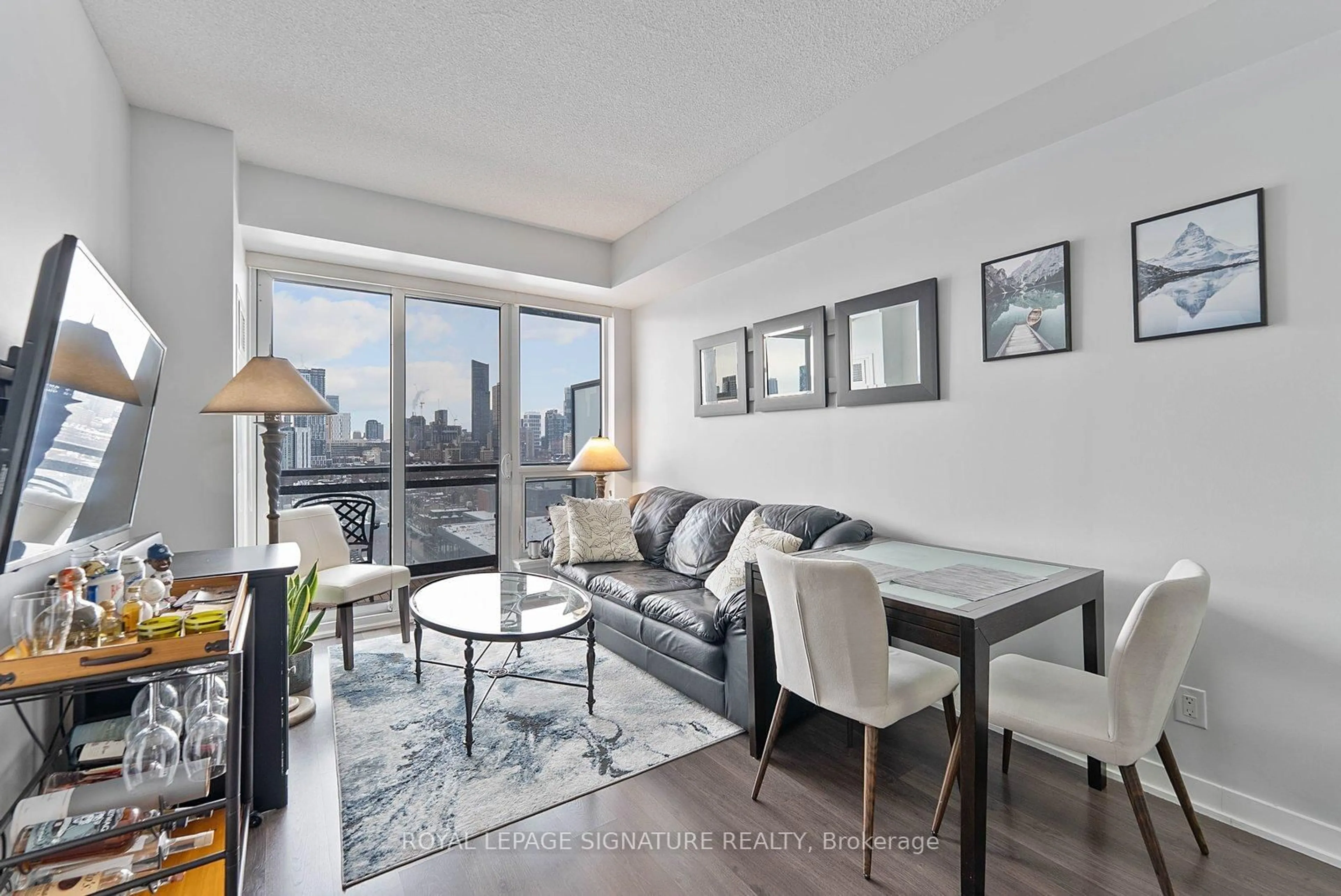 Living room with furniture, wood/laminate floor for 225 Sackville St #1405, Toronto Ontario M5A 3H1