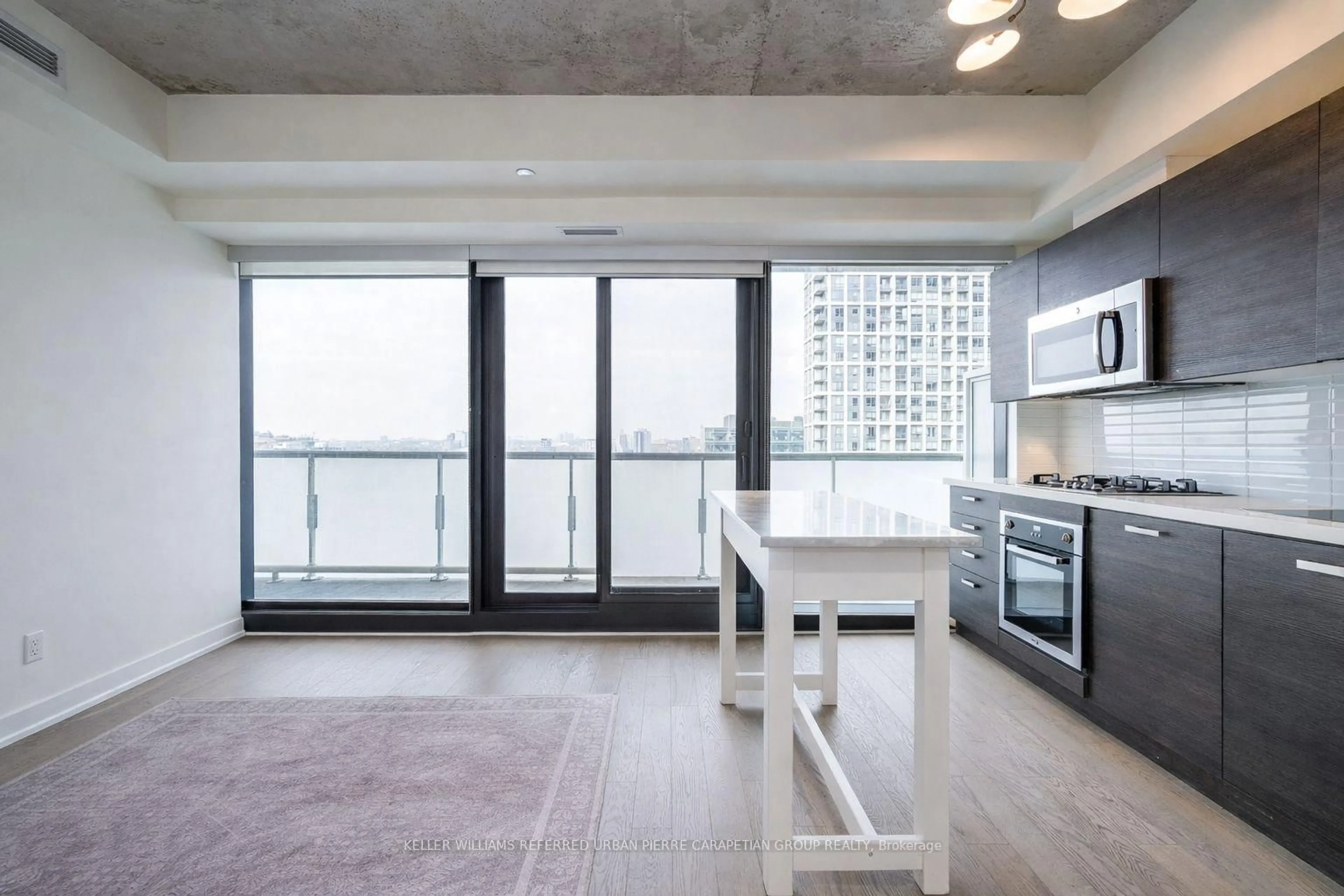 Open concept kitchen, cement floor for 11 Charlotte St #2004, Toronto Ontario M5V 0M6