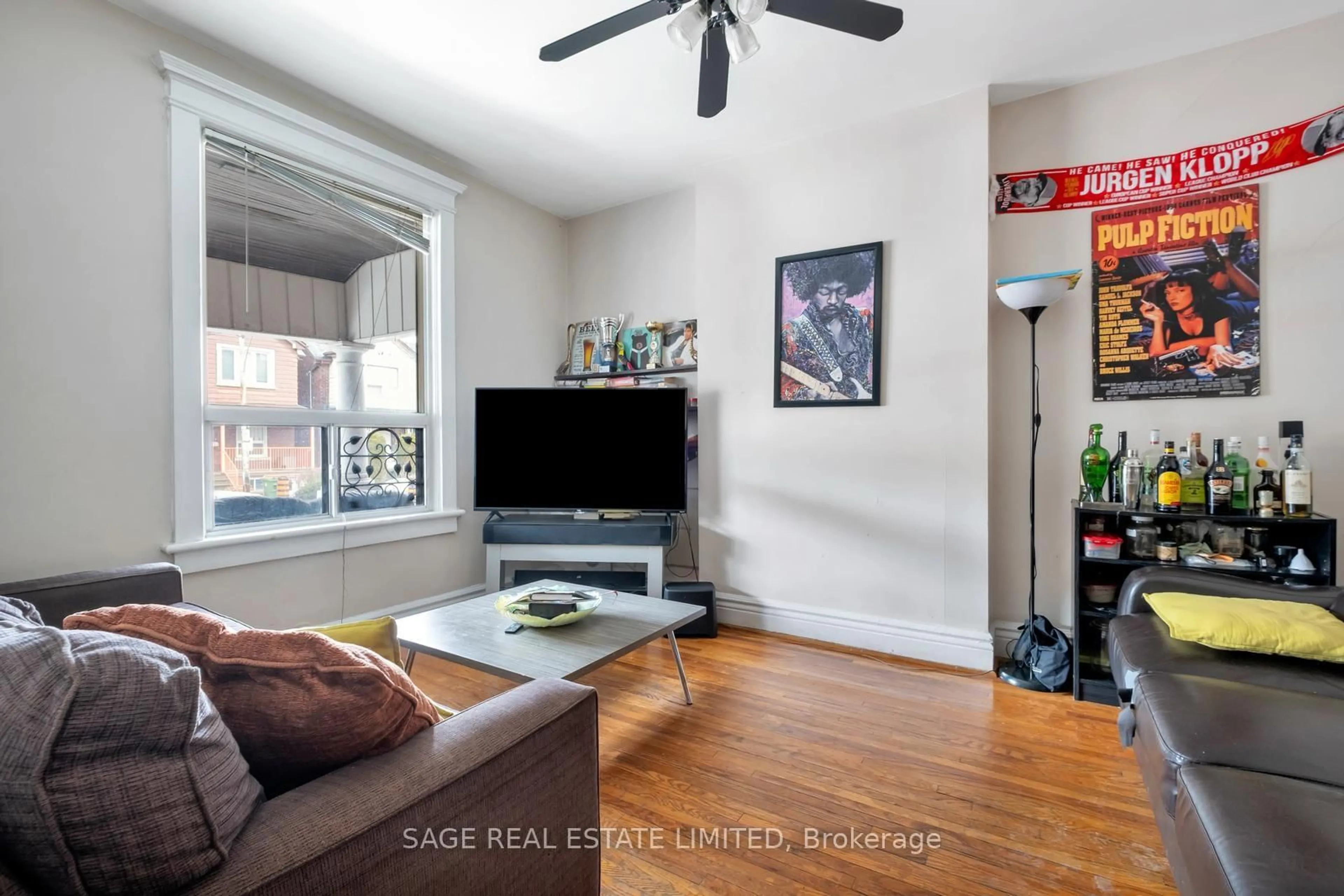 Living room with furniture, wood/laminate floor for 629 Ossington Ave, Toronto Ontario M6G 3T6