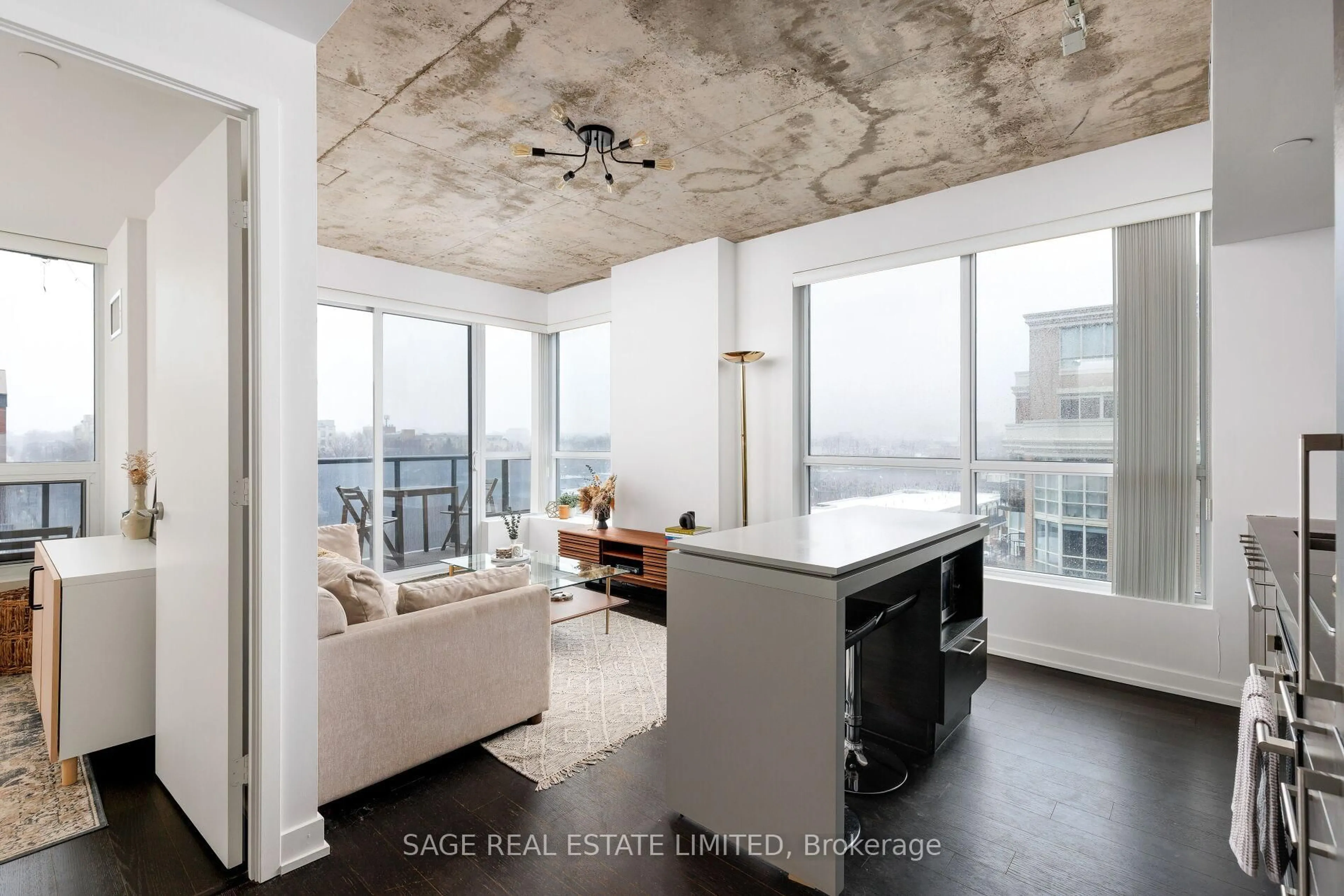 Open concept kitchen, cement floor for 1030 King St #613, Toronto Ontario M6K 3N3