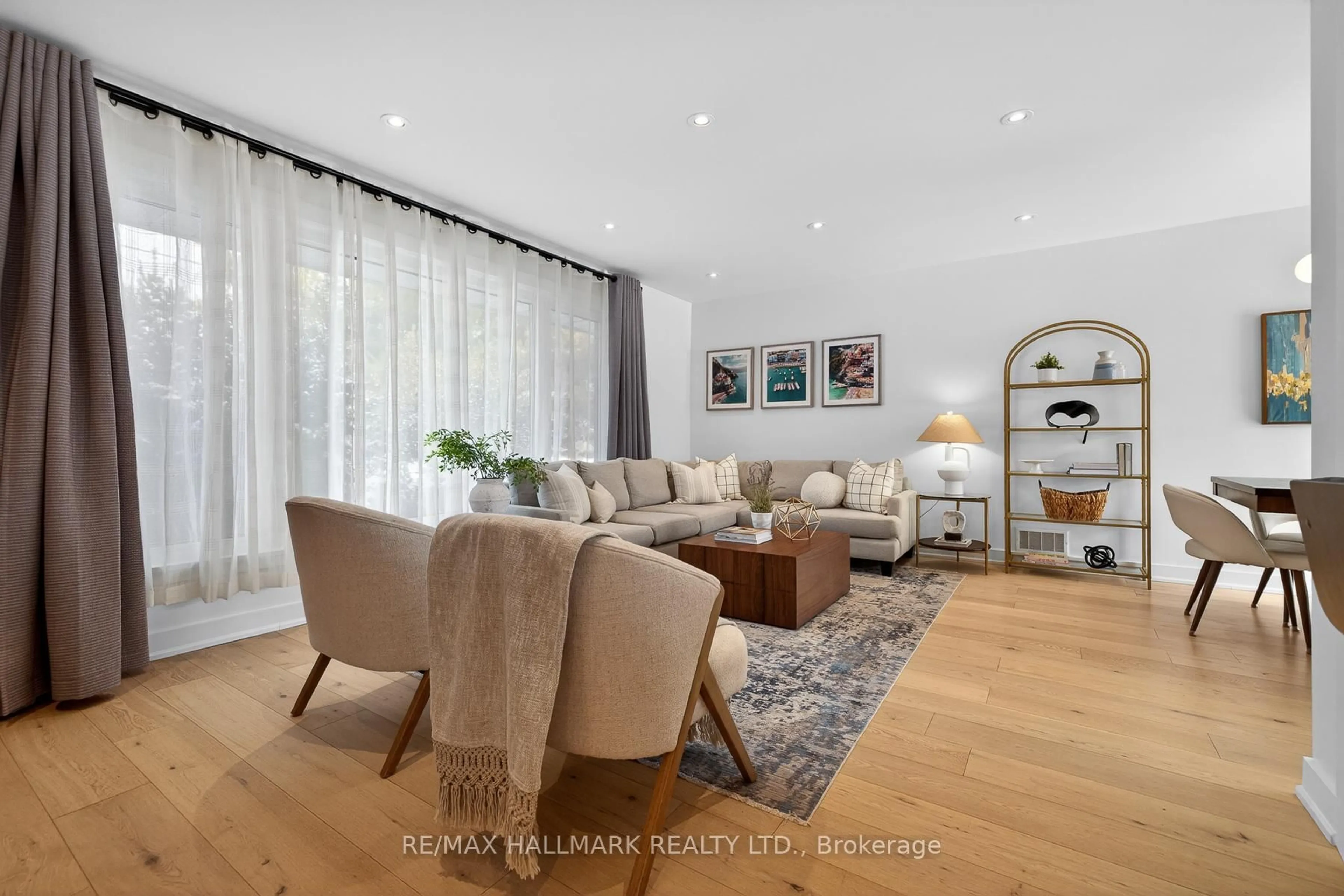 Living room with furniture, wood/laminate floor for 23 Acton Ave, Toronto Ontario M3H 4G6