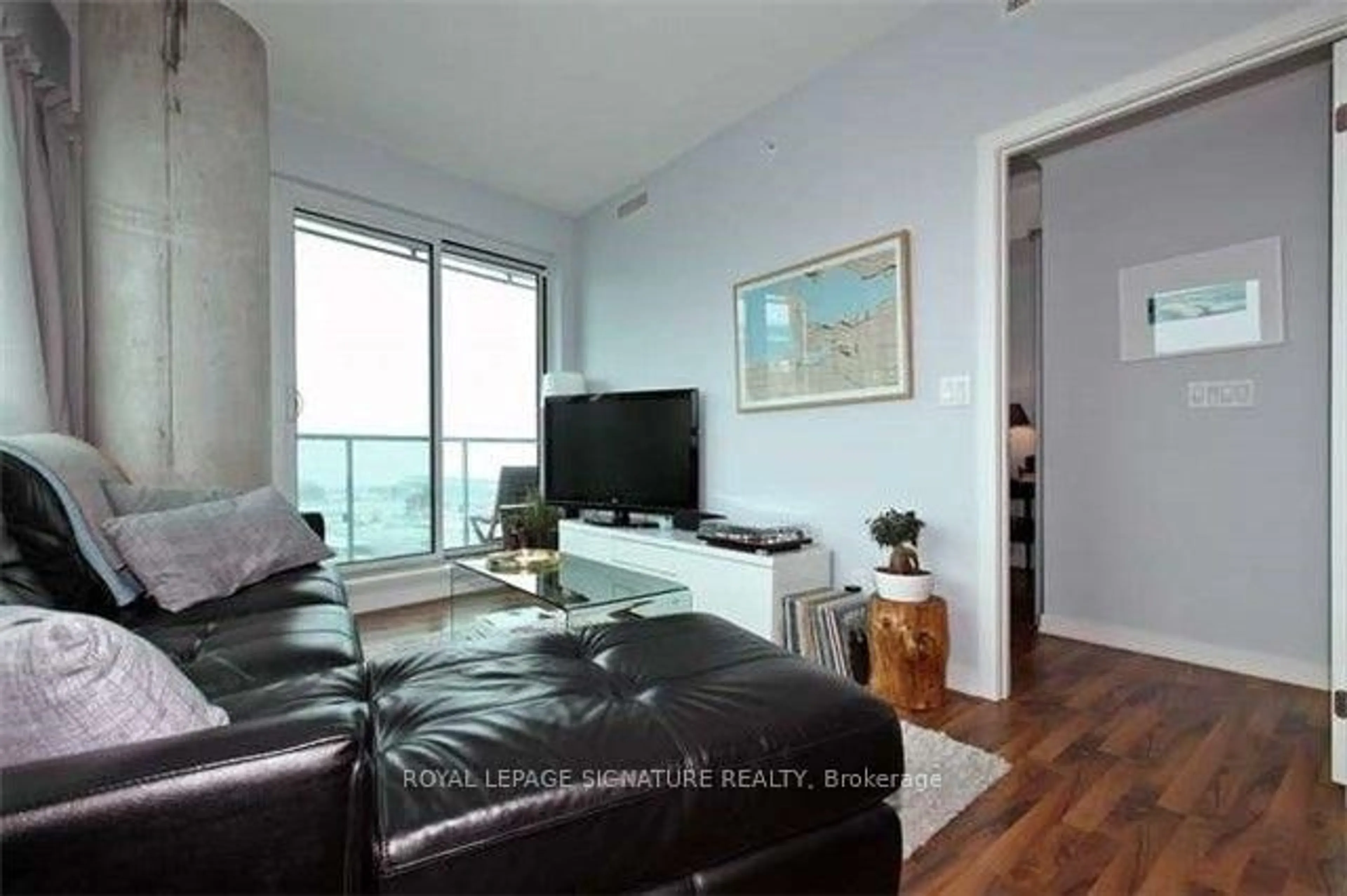 Living room with furniture, wood/laminate floor for 150 East Liberty St #1905, Toronto Ontario M6K 3R5