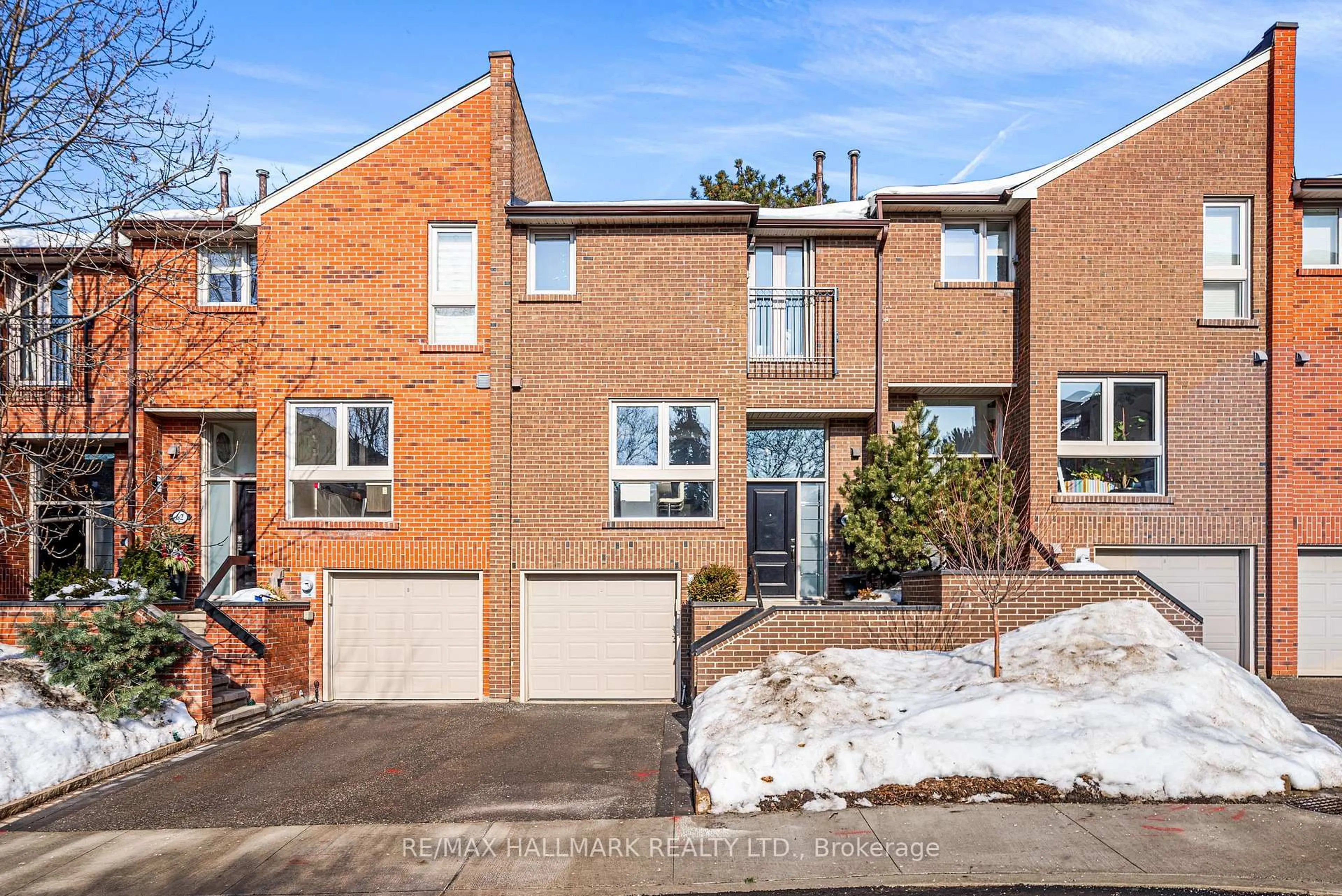 Home with brick exterior material, street for 64 Sylvan Valley Way, Toronto Ontario M5M 4M3