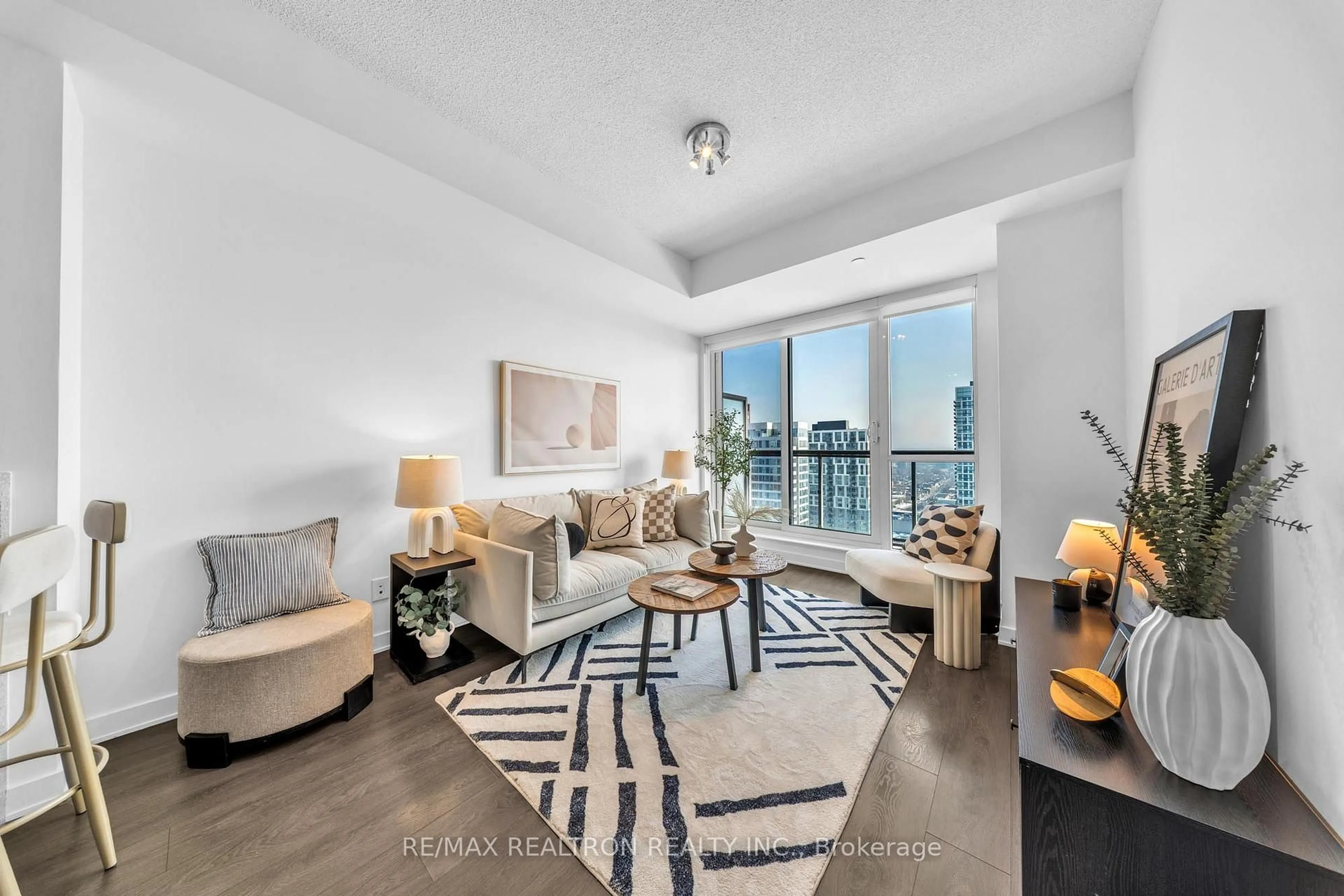 Living room with furniture, unknown for 55 Regent Park Blvd #2701, Toronto Ontario M5A 0C2