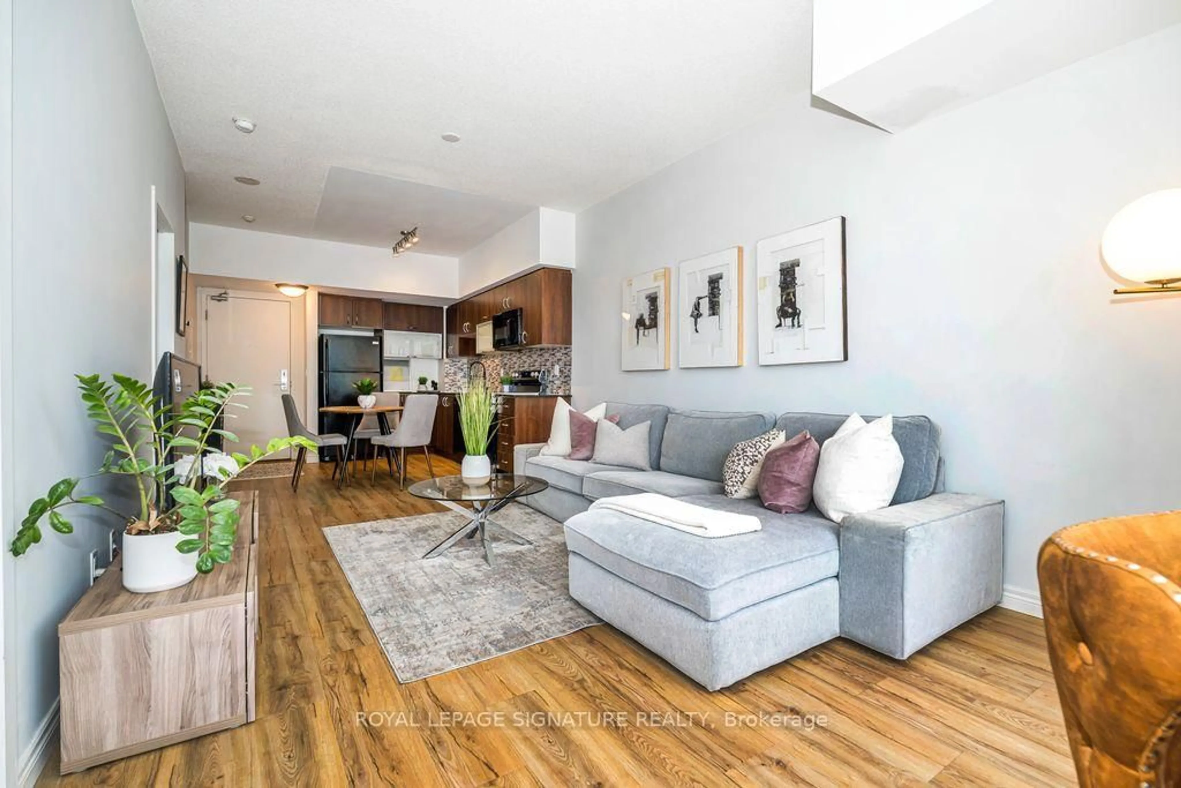 Living room with furniture, wood/laminate floor for 59 East Liberty St #2002, Toronto Ontario M6K 3R1