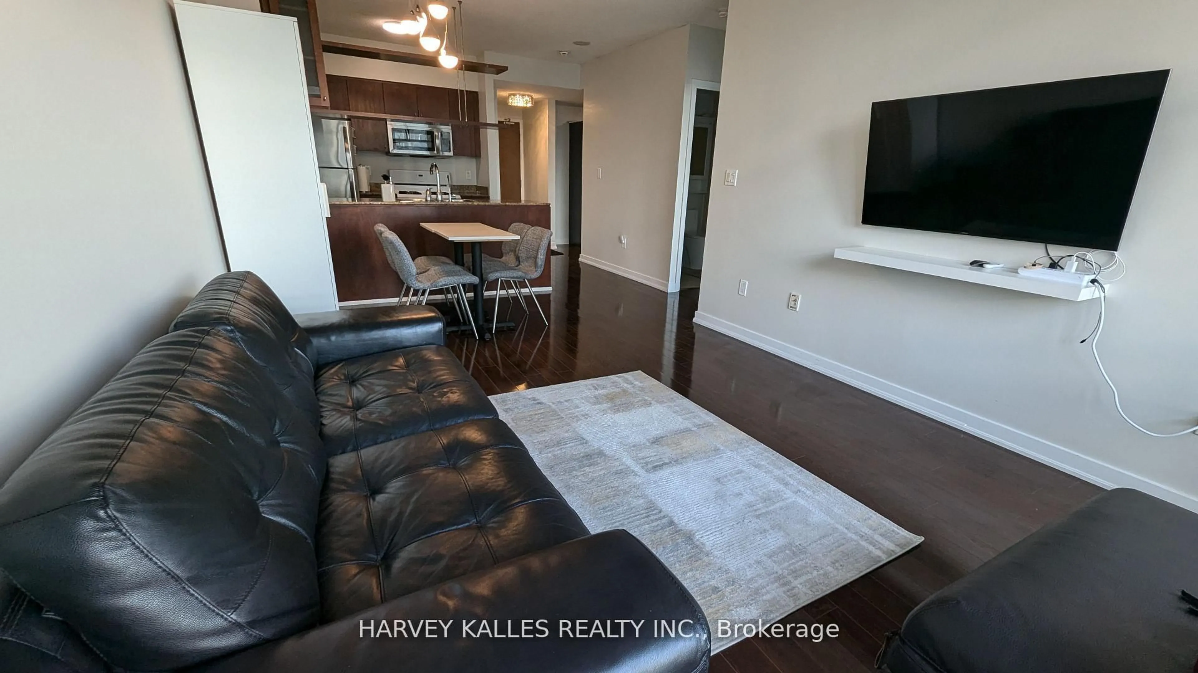 Living room with furniture, wood/laminate floor for 35 Mariner Terr #4001, Toronto Ontario M5V 3V9