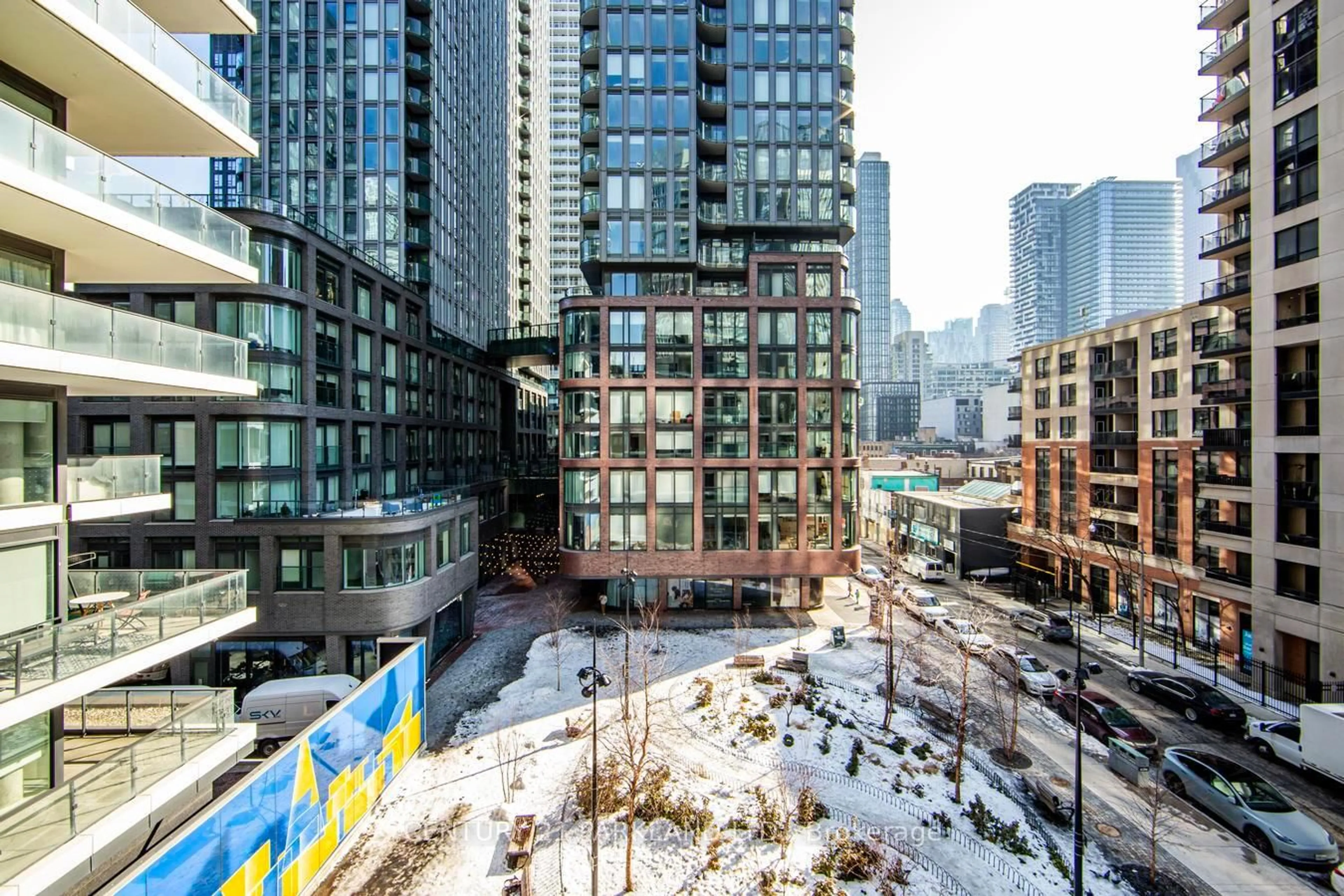 Patio, city buildings view from balcony for 77 Shuter St #527, Toronto Ontario M5B 0B8