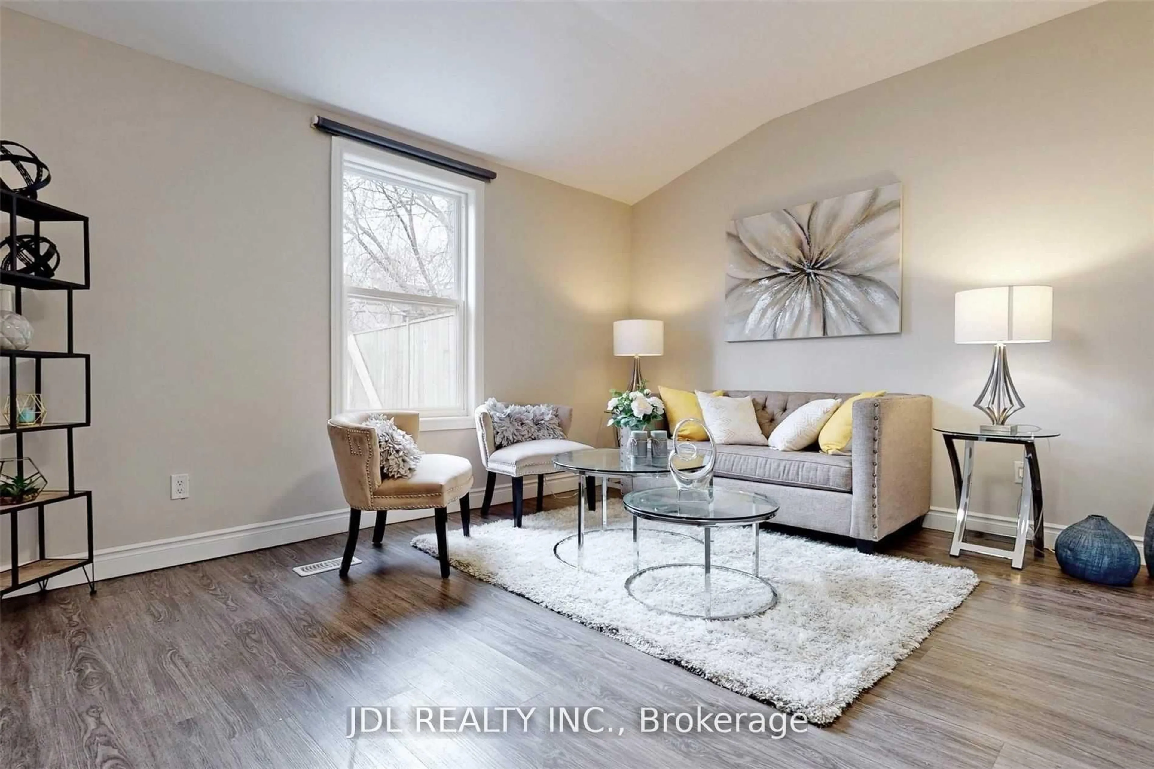 Living room with furniture, wood/laminate floor for 216 Mc Caul St, Toronto Ontario M5T 1W5