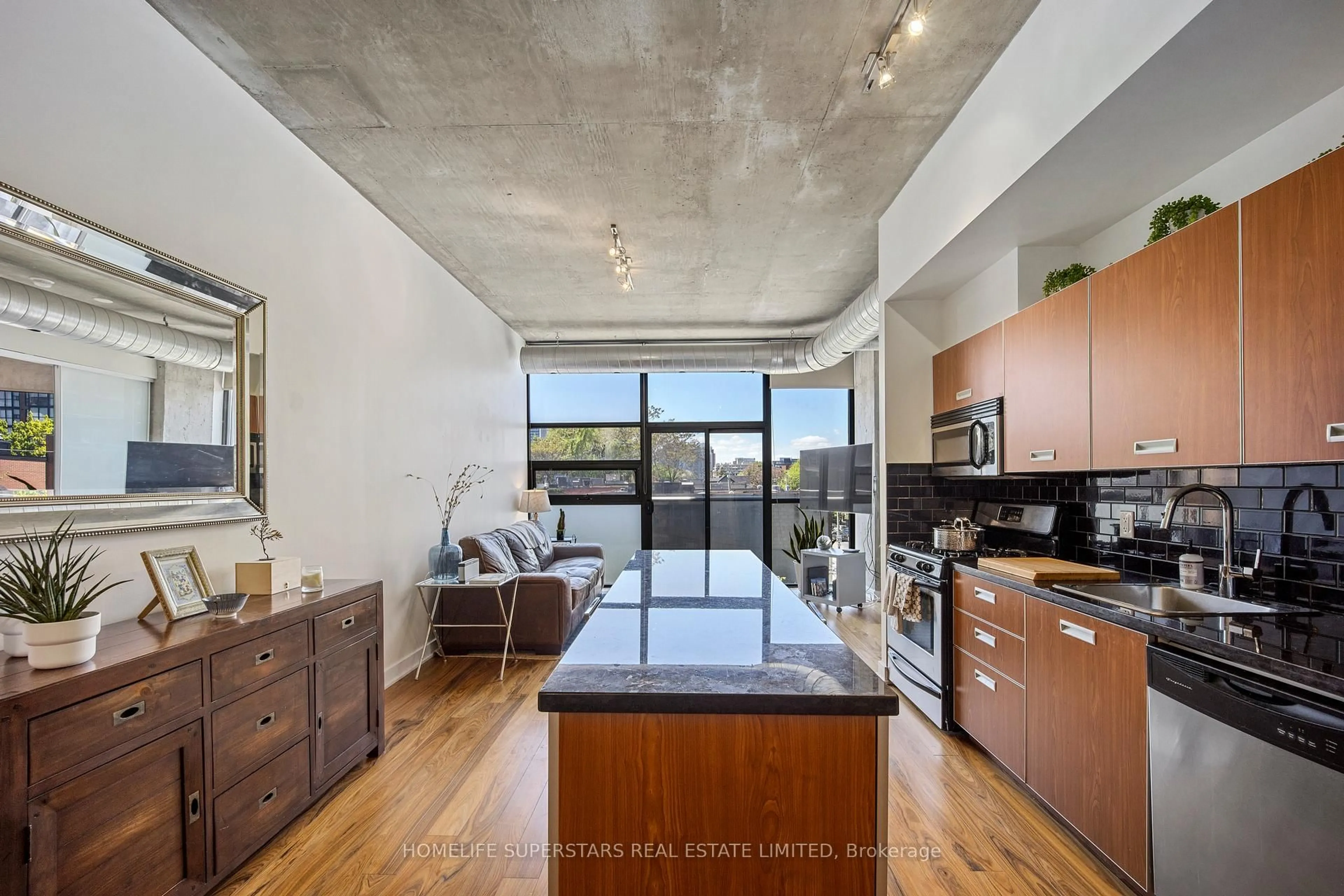 Open concept kitchen, cement floor for 60 Bathurst St #303, Toronto Ontario M5V 2P4