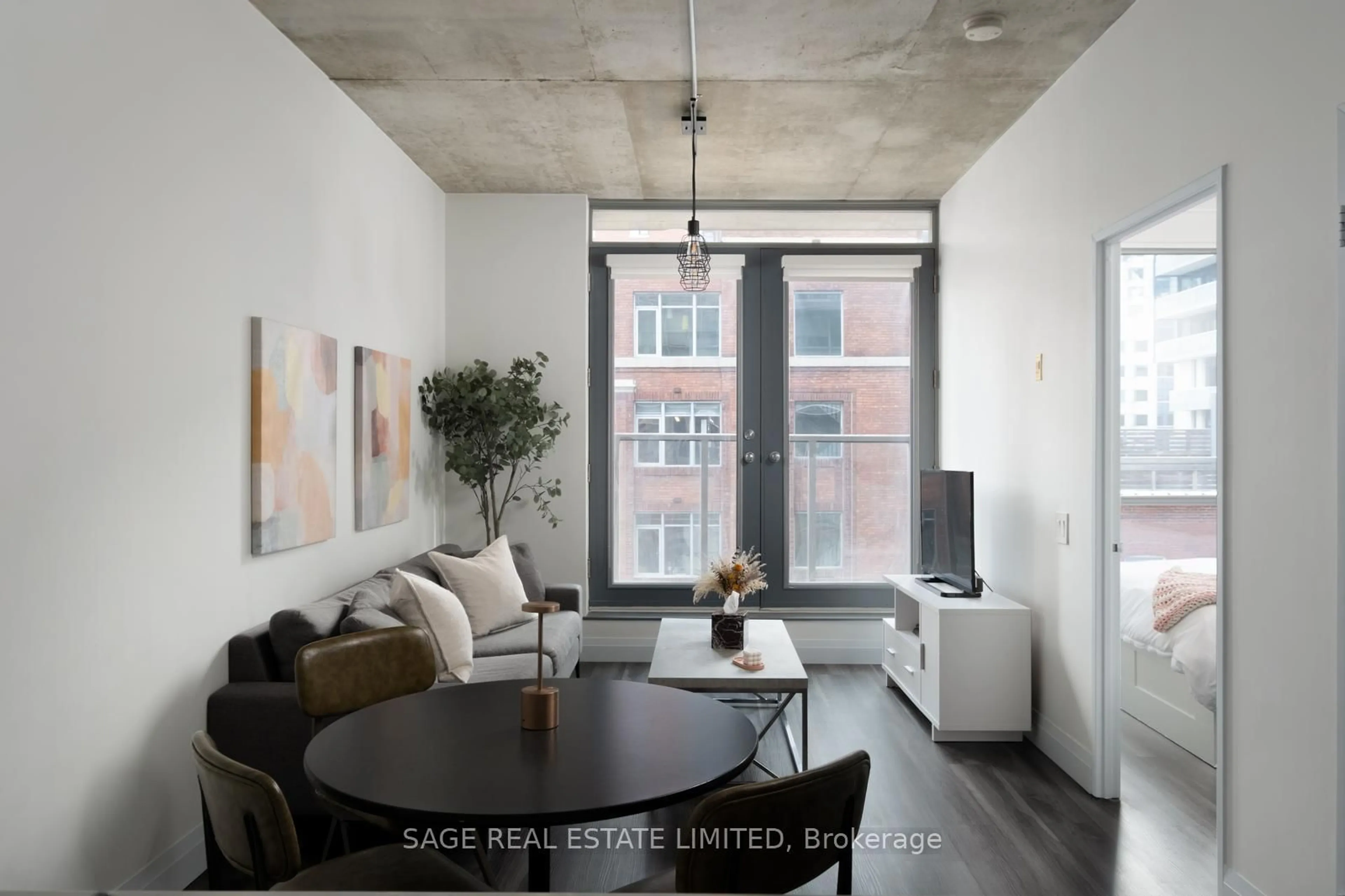 Living room with furniture, cement floor for 36 Charlotte St #603, Toronto Ontario M5V 3P7