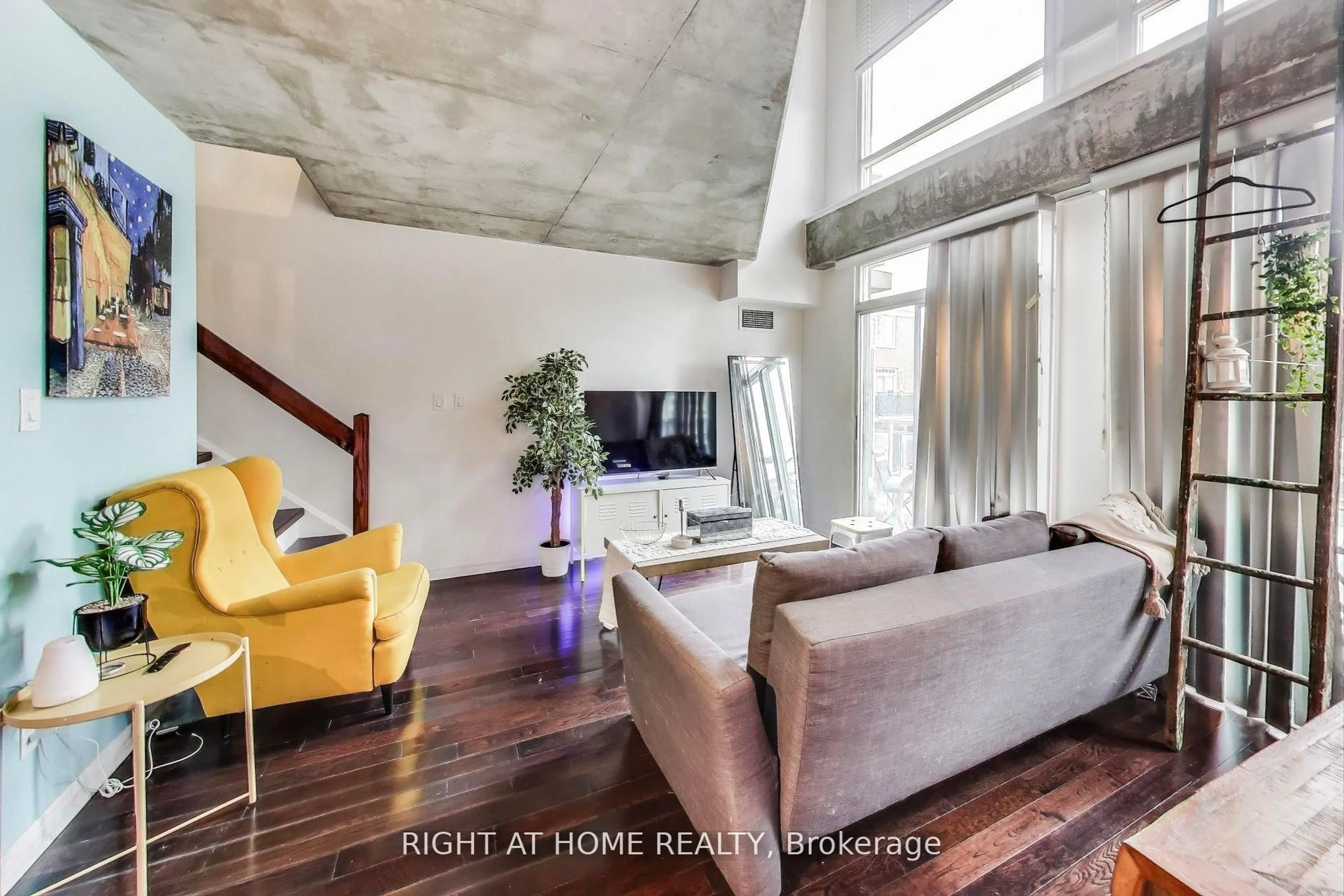 Living room with furniture, cement floor for 1029 King St #246, Toronto Ontario M6K 3M9