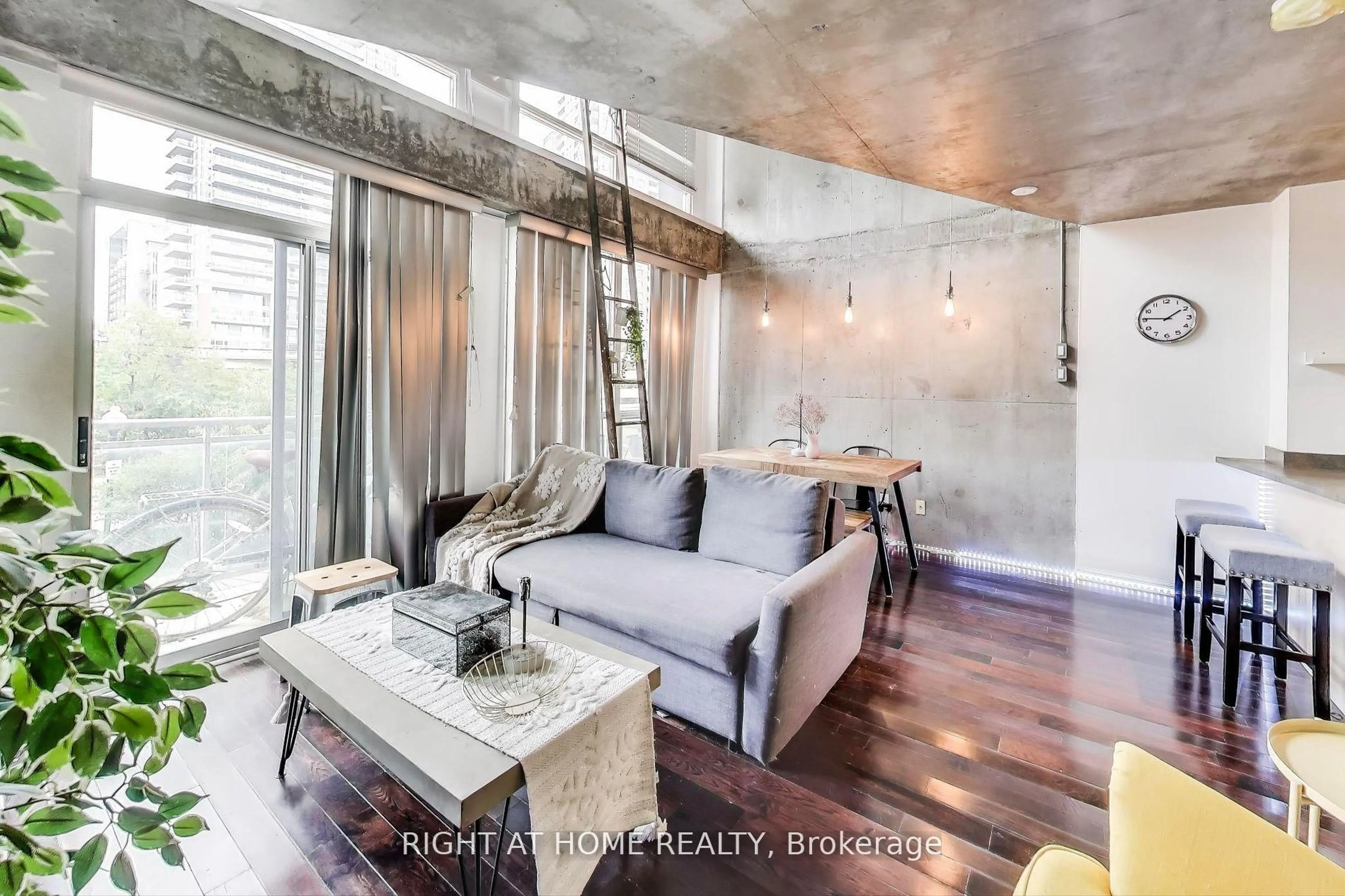 Living room with furniture, cement floor for 1029 King St #246, Toronto Ontario M6K 3M9