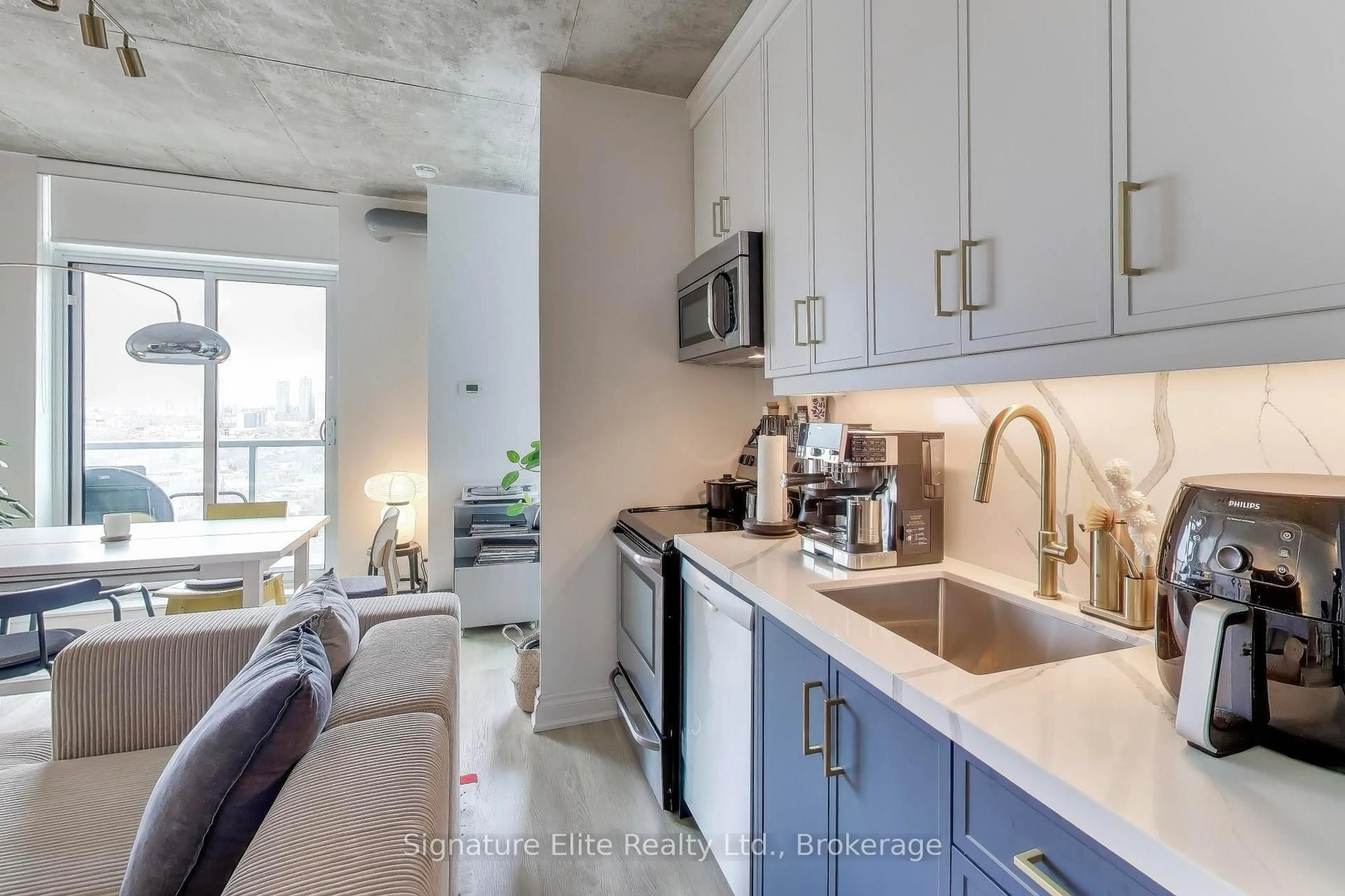 Open concept kitchen, cement floor for 150 Sudbury St #1703, Toronto Ontario M6J 3S8