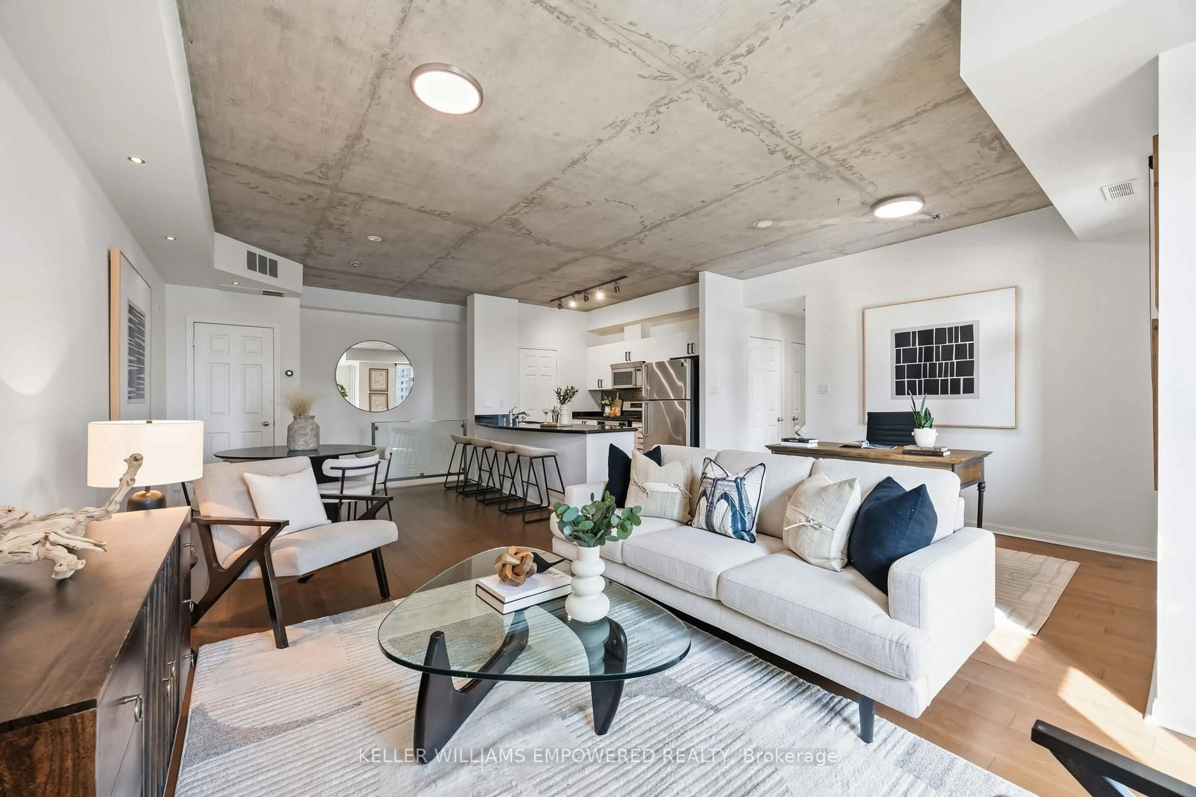 Living room with furniture, cement floor for 550 Front St #401, Toronto Ontario M5V 3N5