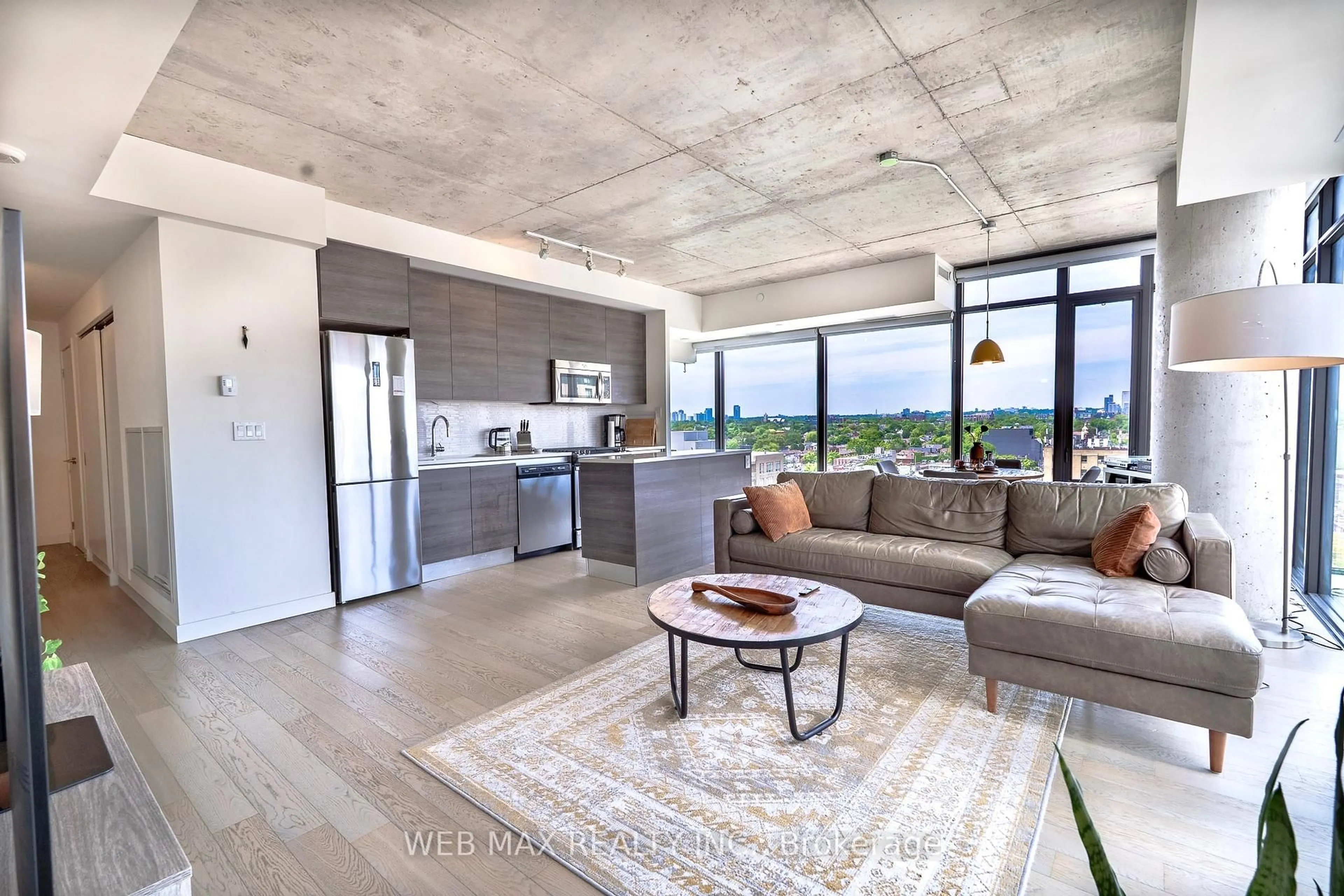 Open concept kitchen, cement floor for 111 Bathurst St #Unit 1005, Toronto Ontario M5V 0M9