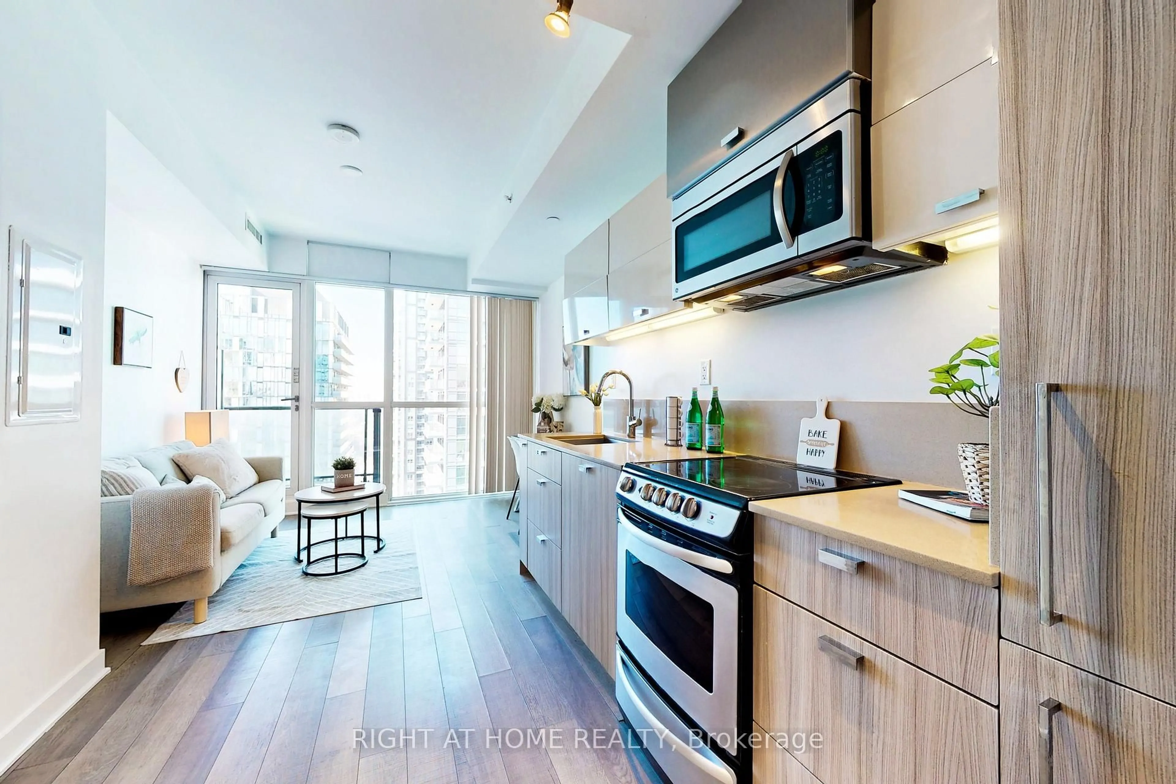 Open concept kitchen, wood/laminate floor for 290 Adelaide St #3603, Toronto Ontario M5V 1P6