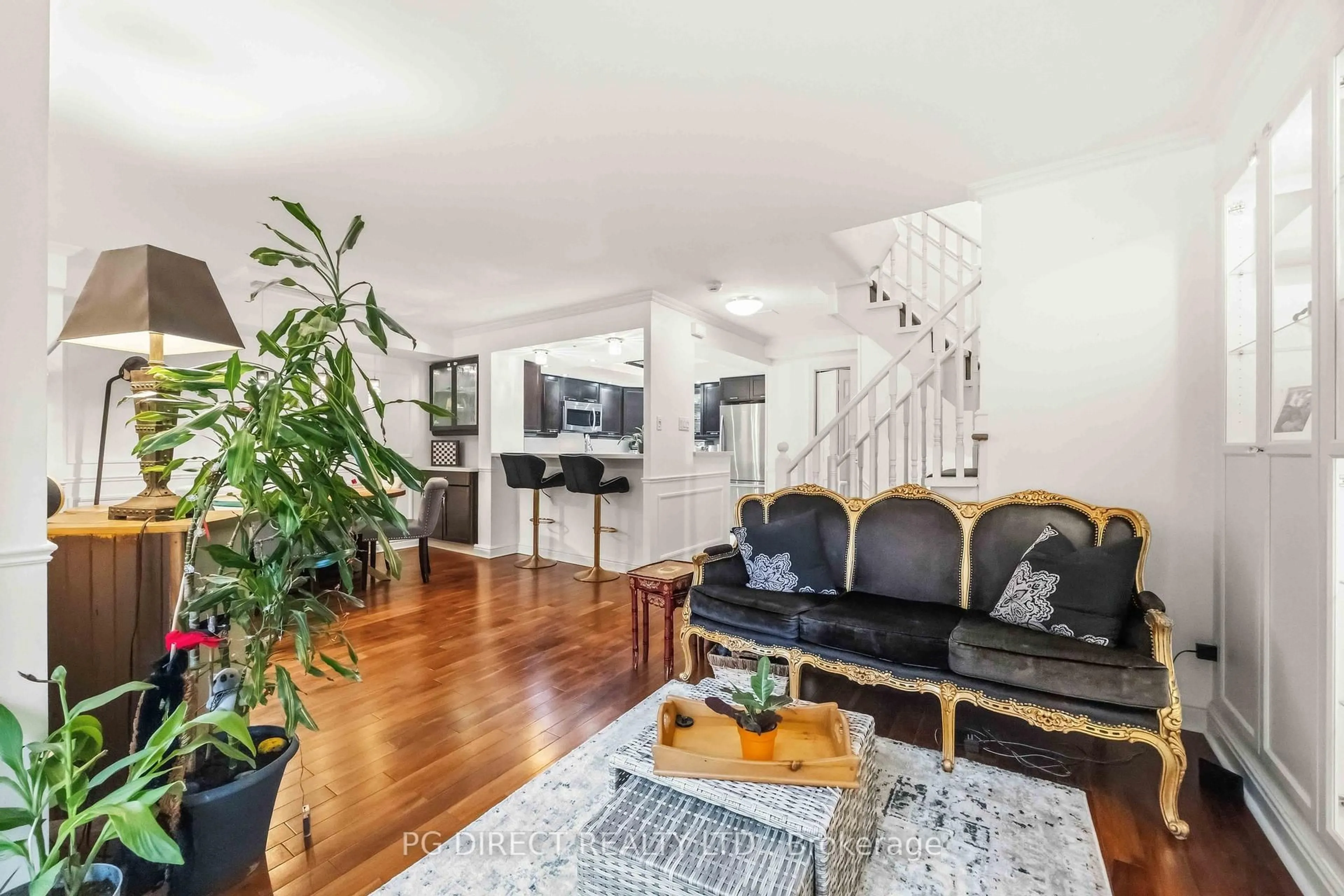 Living room with furniture, wood/laminate floor for 60 Homewood Ave #112, Toronto Ontario M4Y 2X4