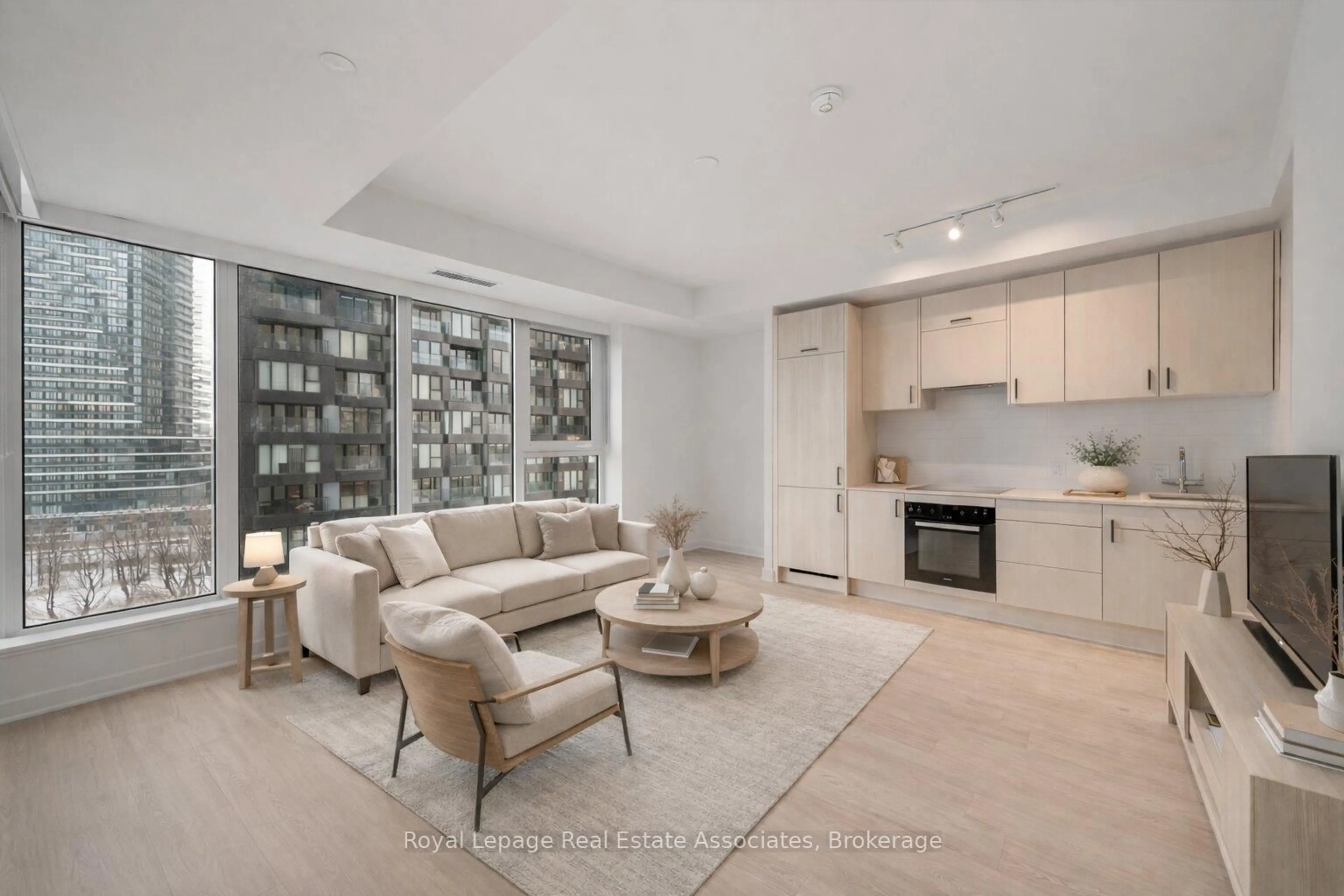 Living room with furniture, unknown for 1 Quarrington Lane #1004, Toronto Ontario M3C 0S4