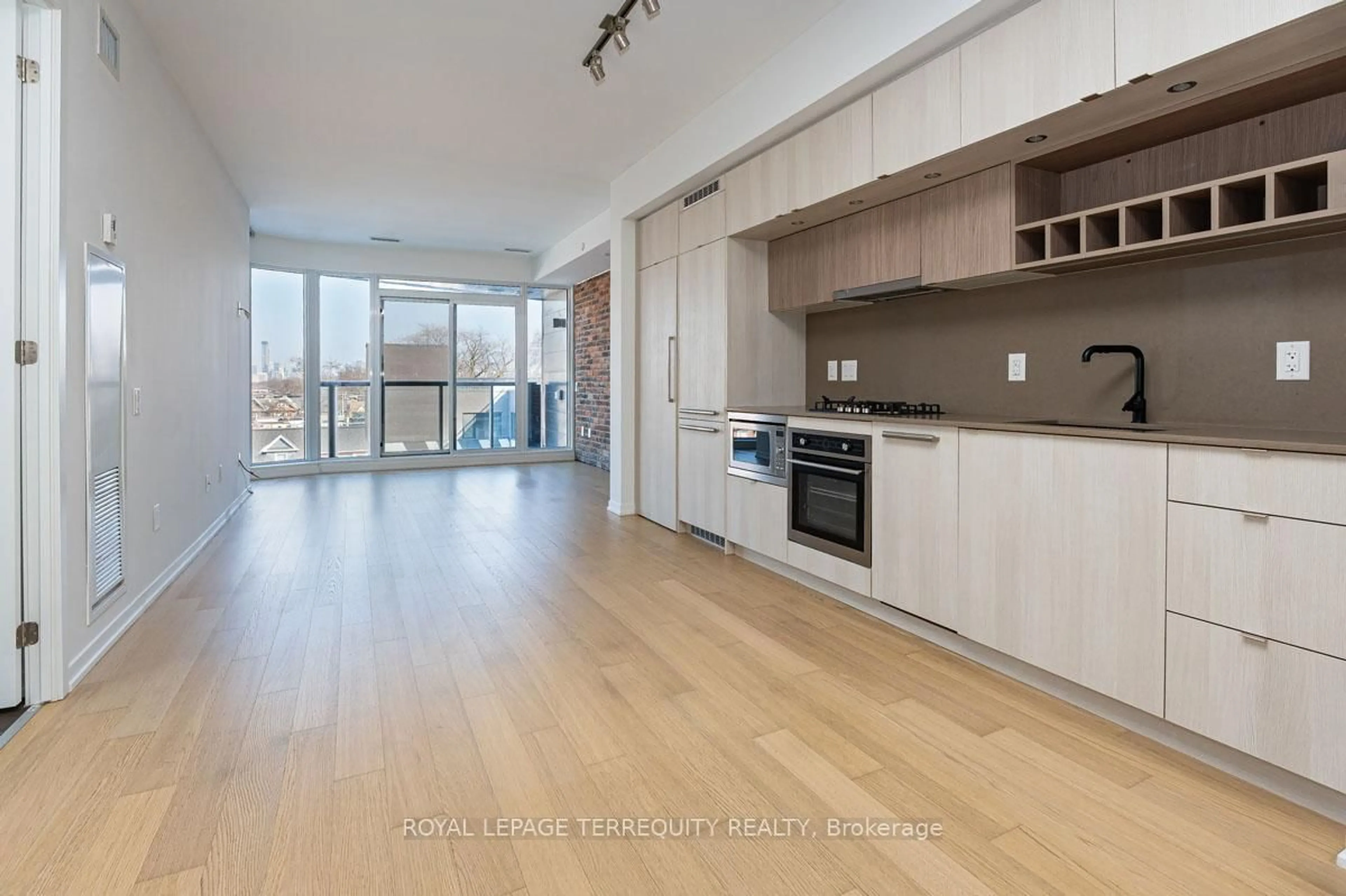 Open concept kitchen, wood/laminate floor for 138 St Helens Ave #501, Toronto Ontario M6H 0B8