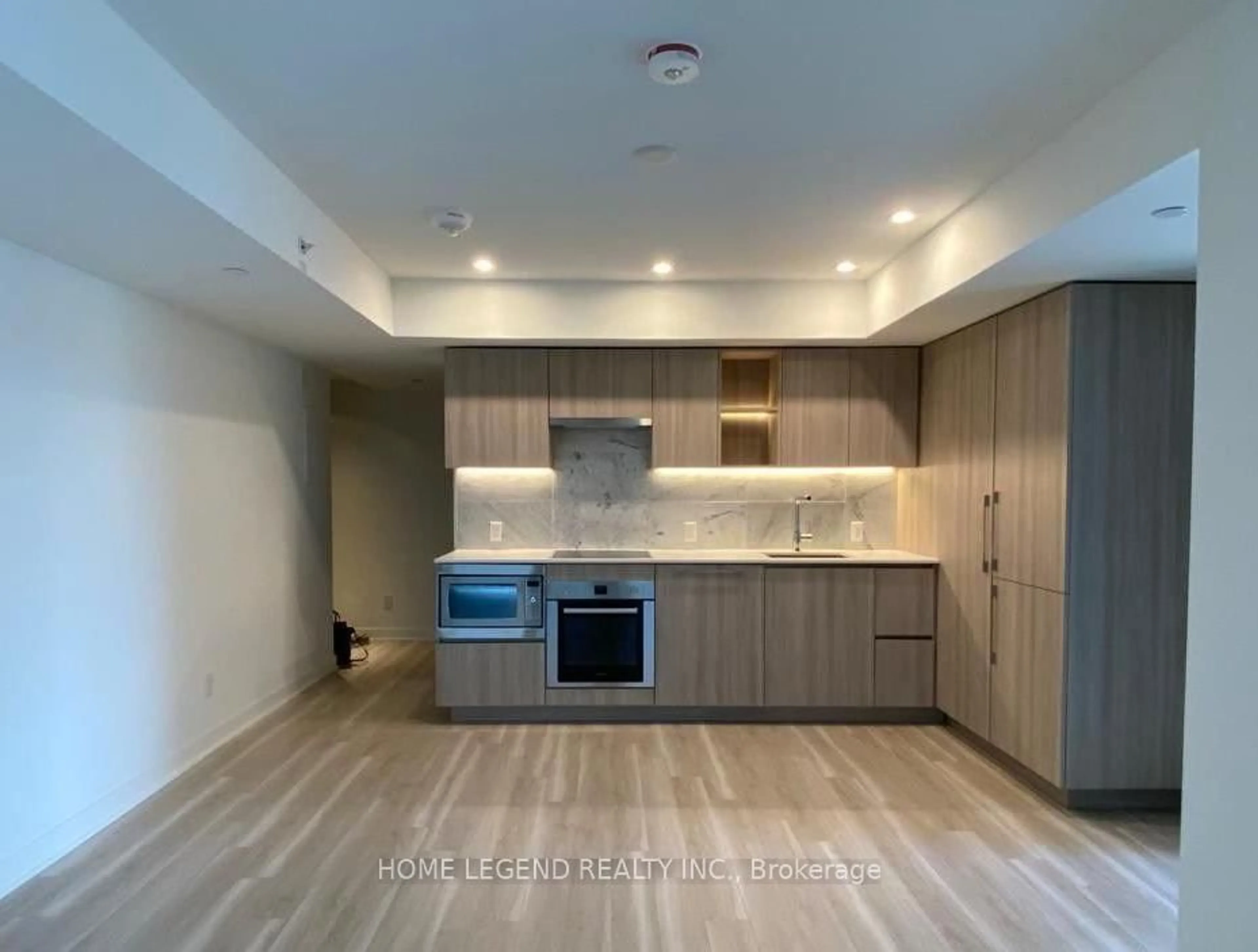 Open concept kitchen, wood/laminate floor for 17 Bathurst St #710, Toronto Ontario M5V 0N1