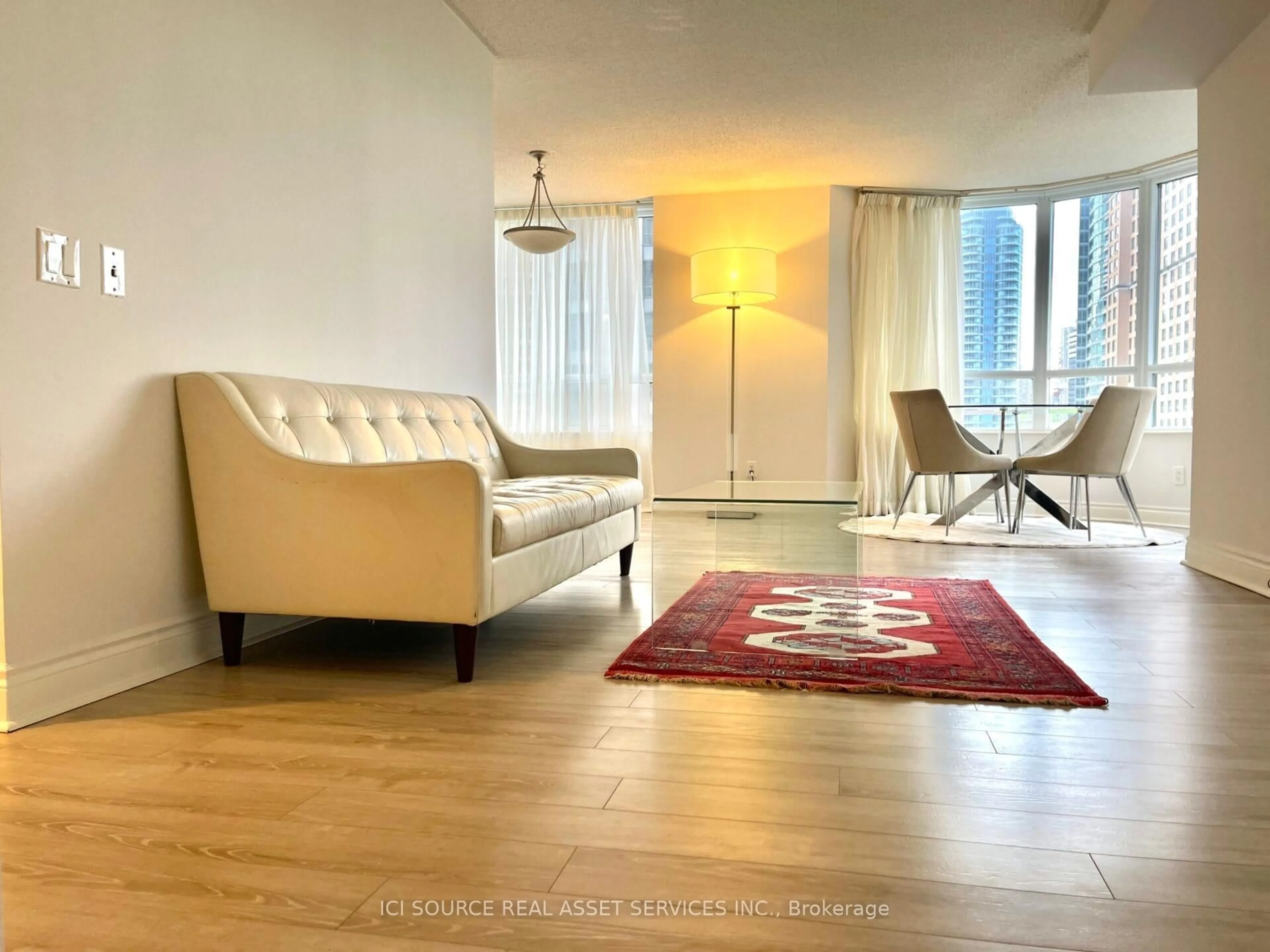 Living room with furniture, wood/laminate floor for 15 Northtown Way #519, Toronto Ontario M2N 7A2