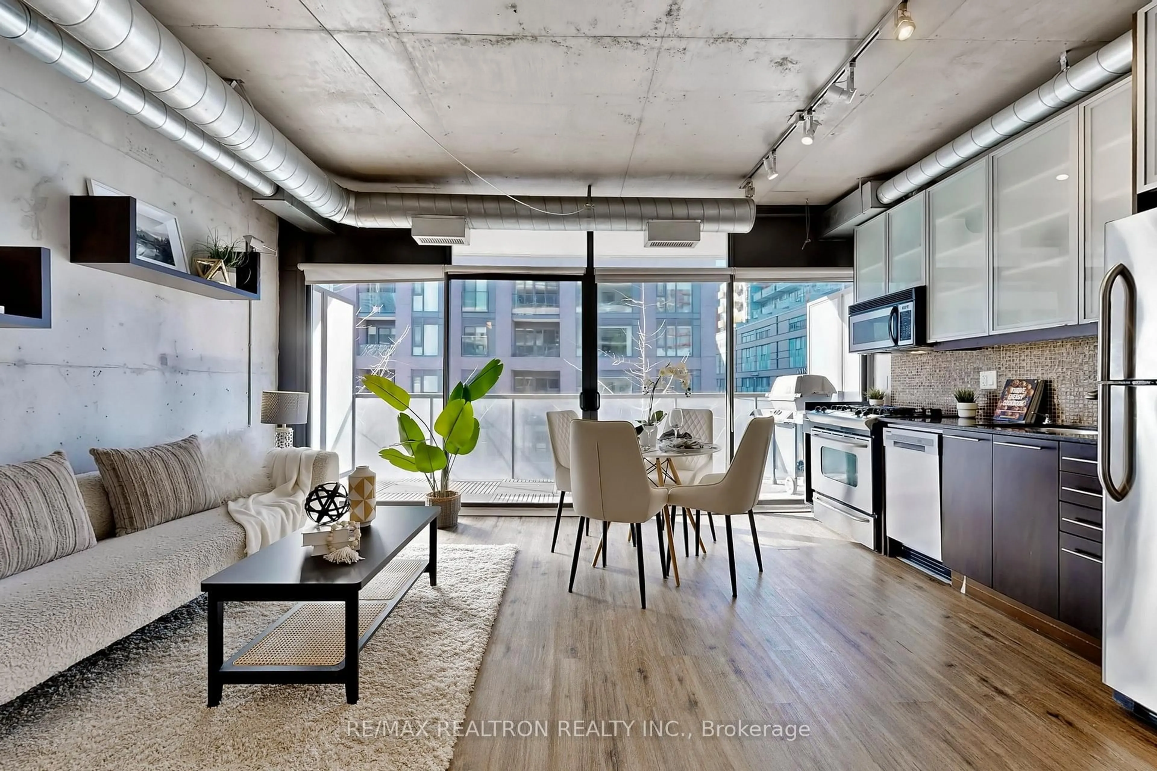 Open concept kitchen, cement floor for 533 Richmond St #408, Toronto Ontario M5V 3Y1