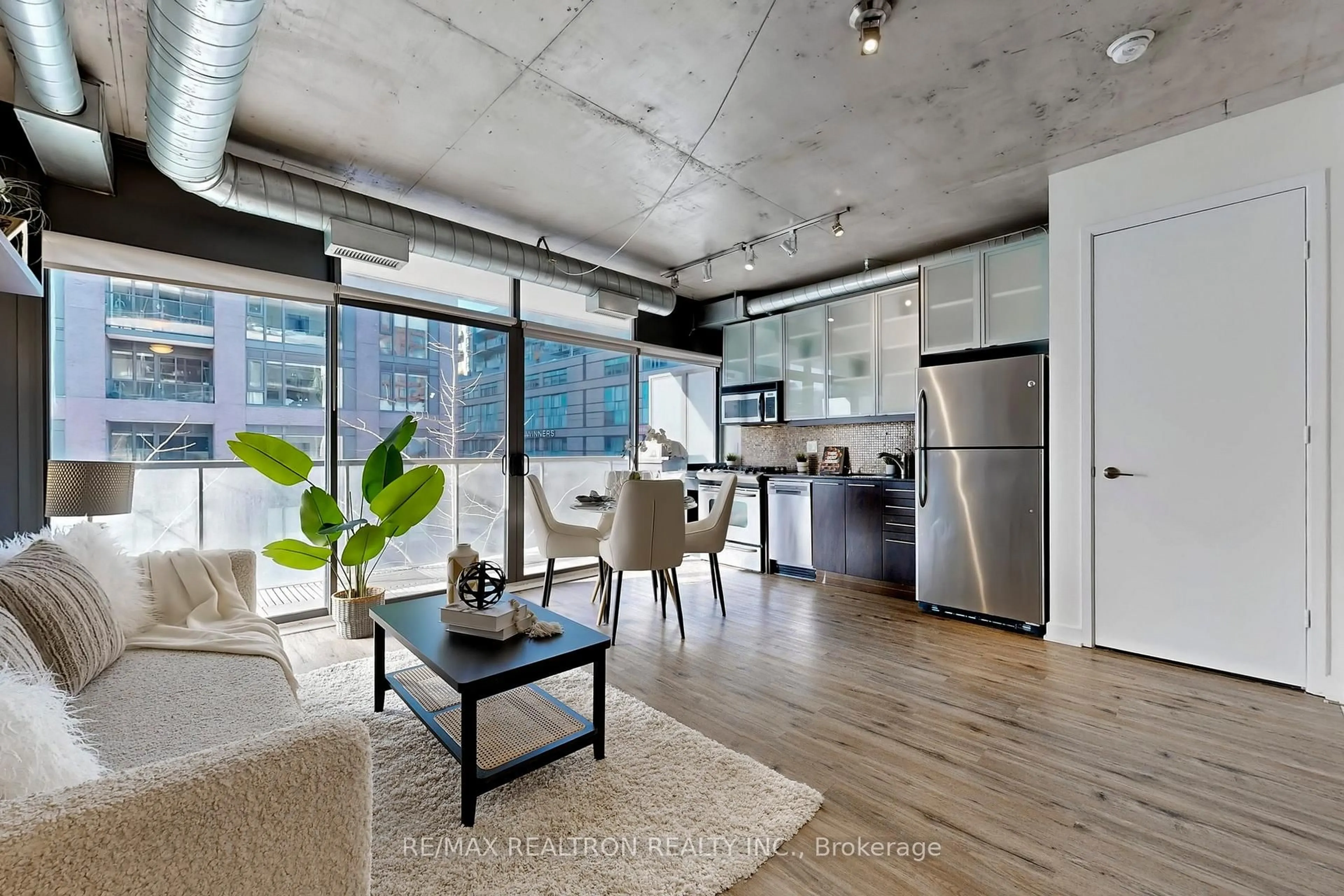 Open concept kitchen, cement floor for 533 Richmond St #408, Toronto Ontario M5V 3Y1