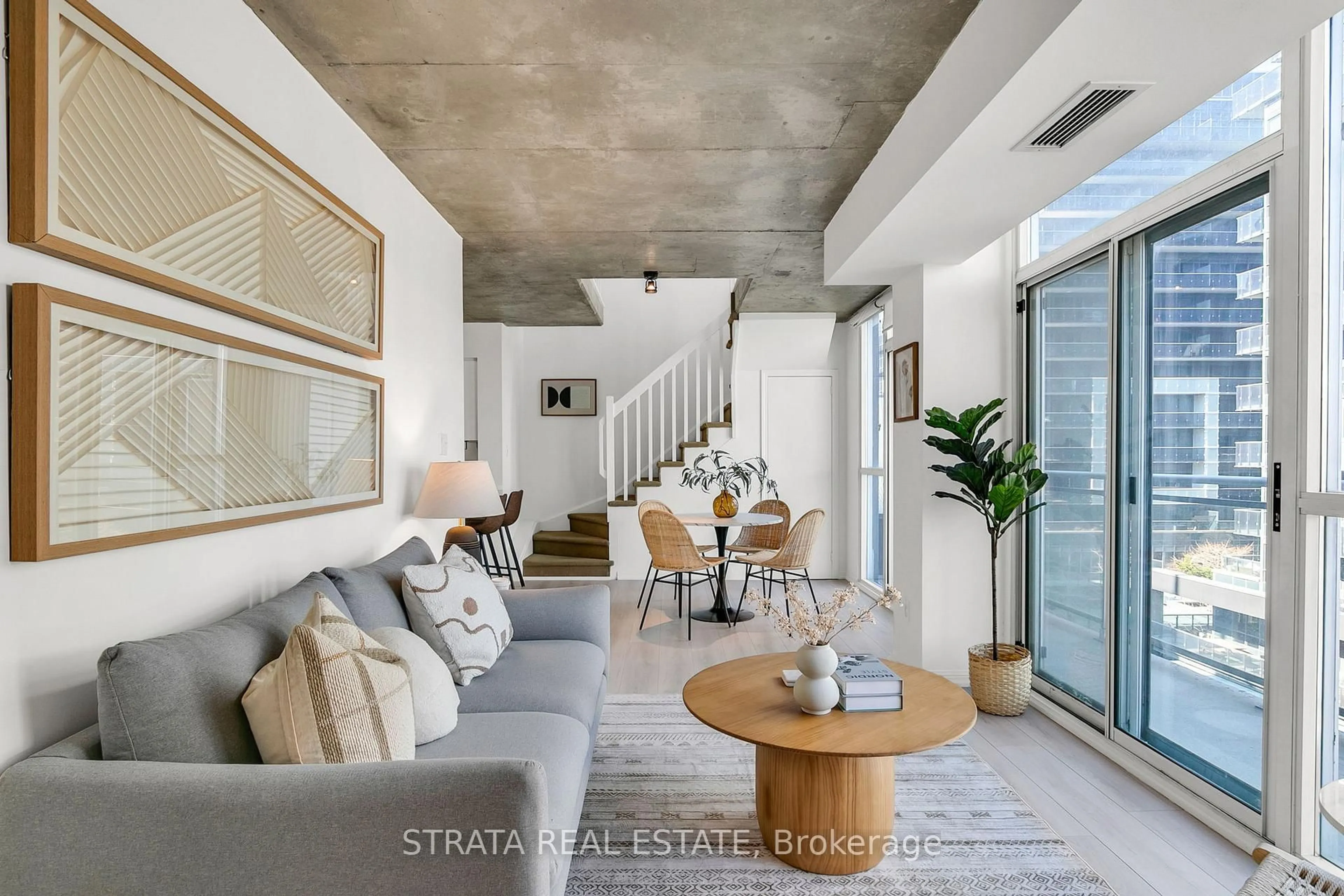 Living room with furniture, cement floor for 1029 King St #629, Toronto Ontario M6K 3M9