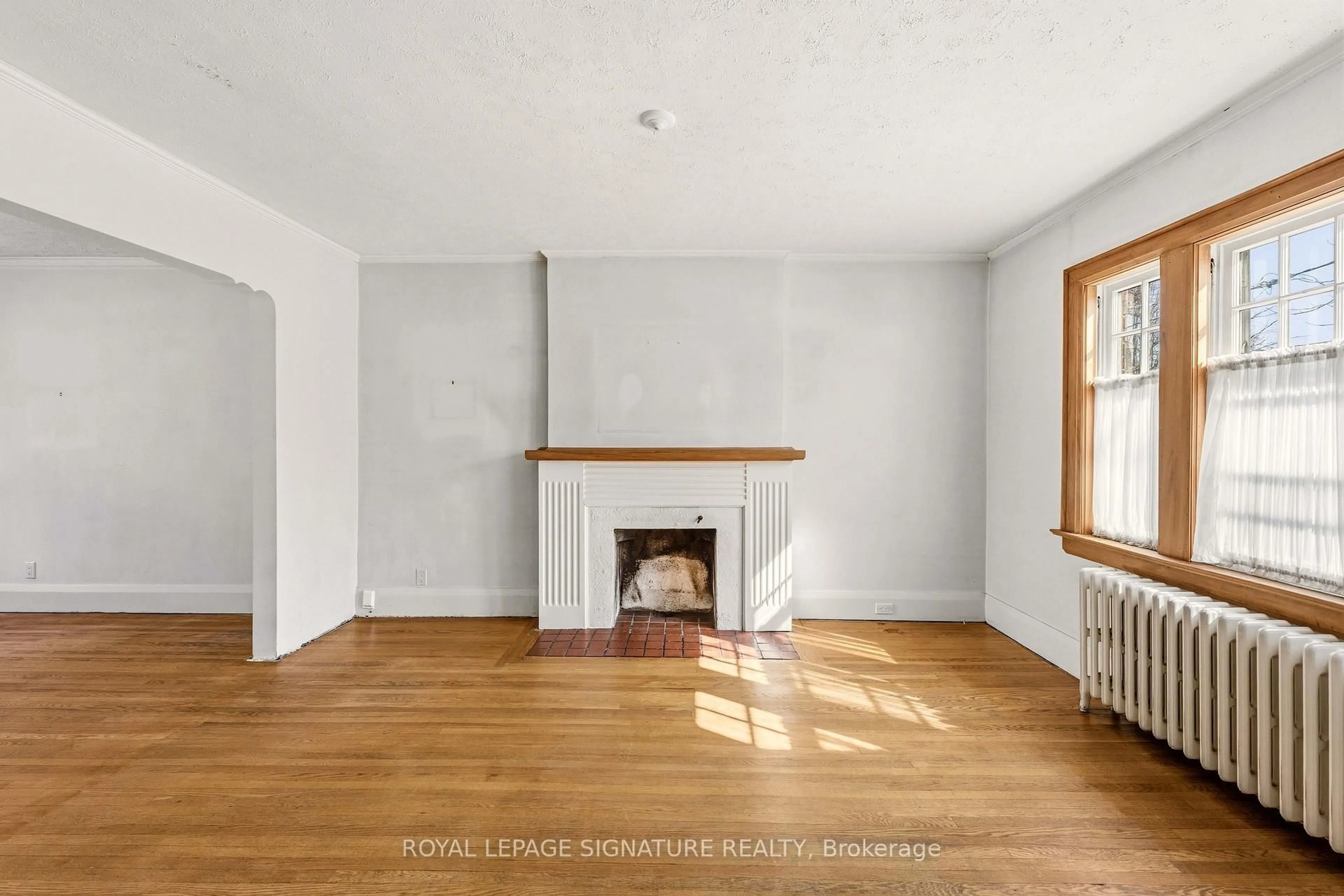 Living room with furniture, wood/laminate floor for 212 Cranbrooke Ave, Toronto Ontario M5M 1M7