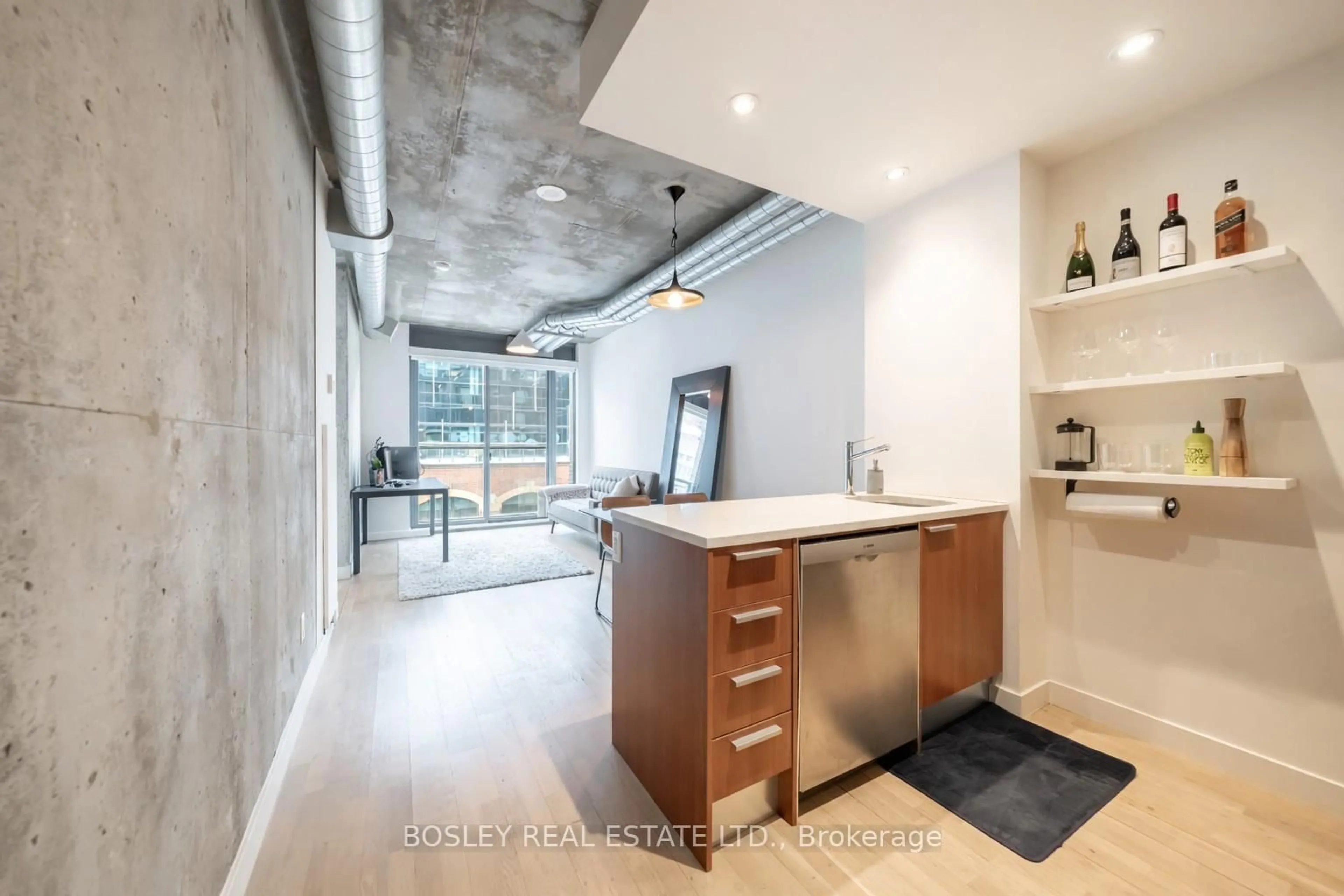 Open concept kitchen, cement floor for 138 Princess St #409, Toronto Ontario M5A 0B1