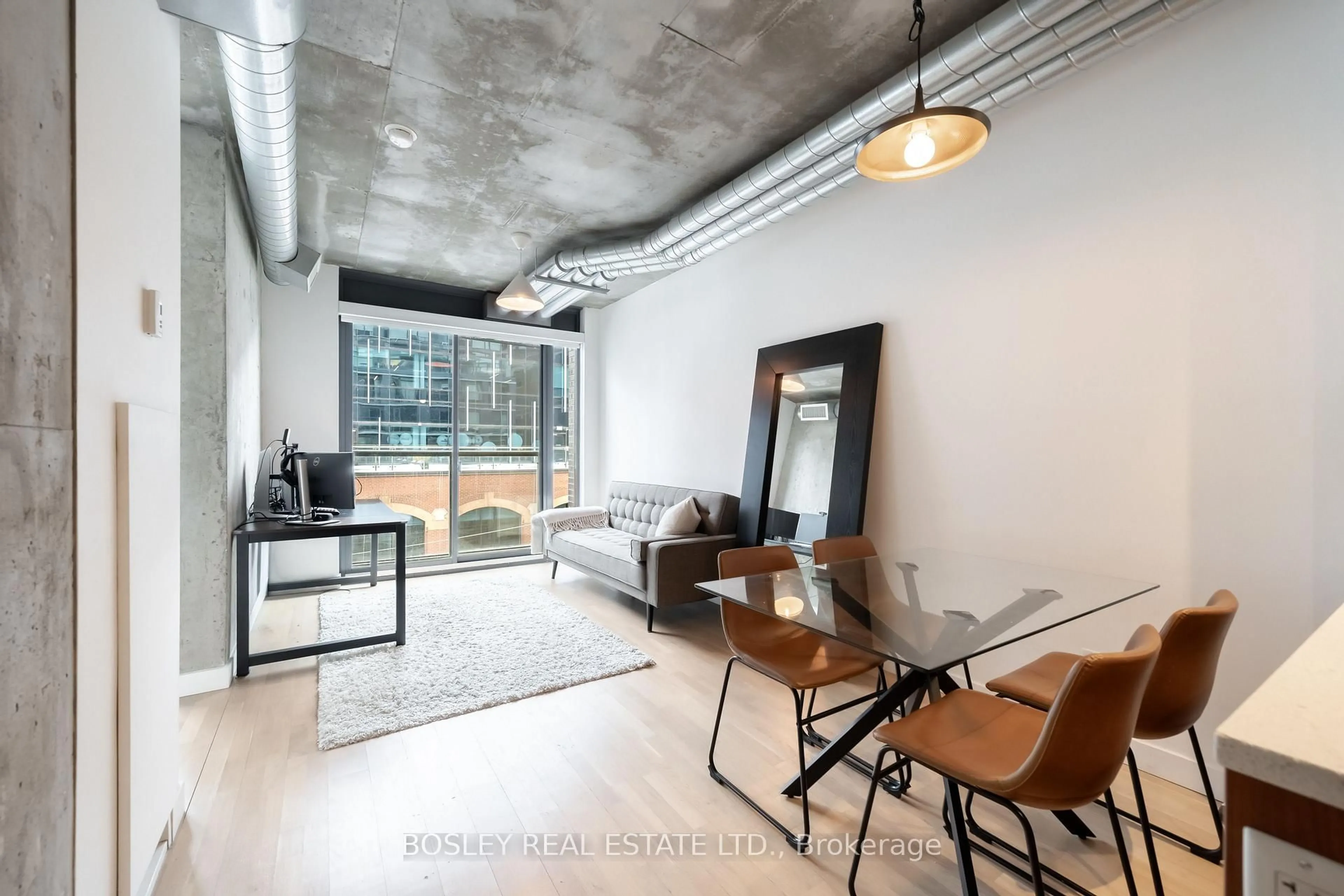 Living room with furniture, cement floor for 138 Princess St #409, Toronto Ontario M5A 0B1