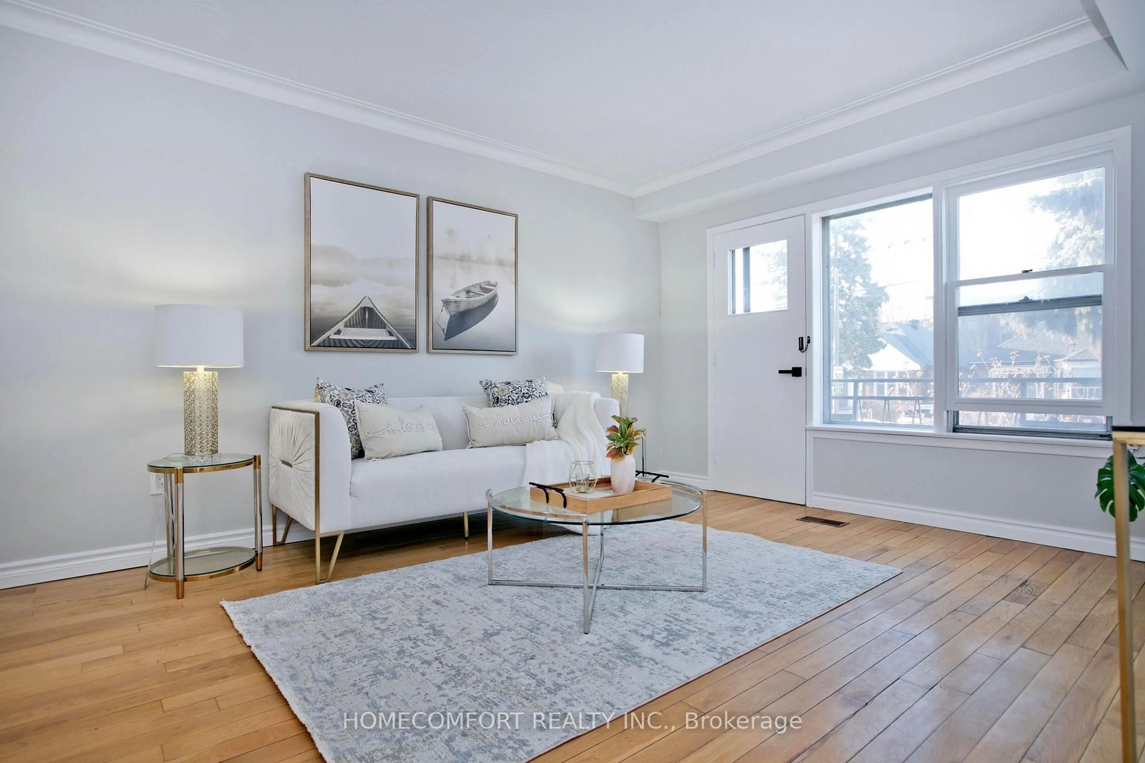 Living room with furniture, wood/laminate floor for 55 Lanark Ave, Toronto Ontario M6C 2B5