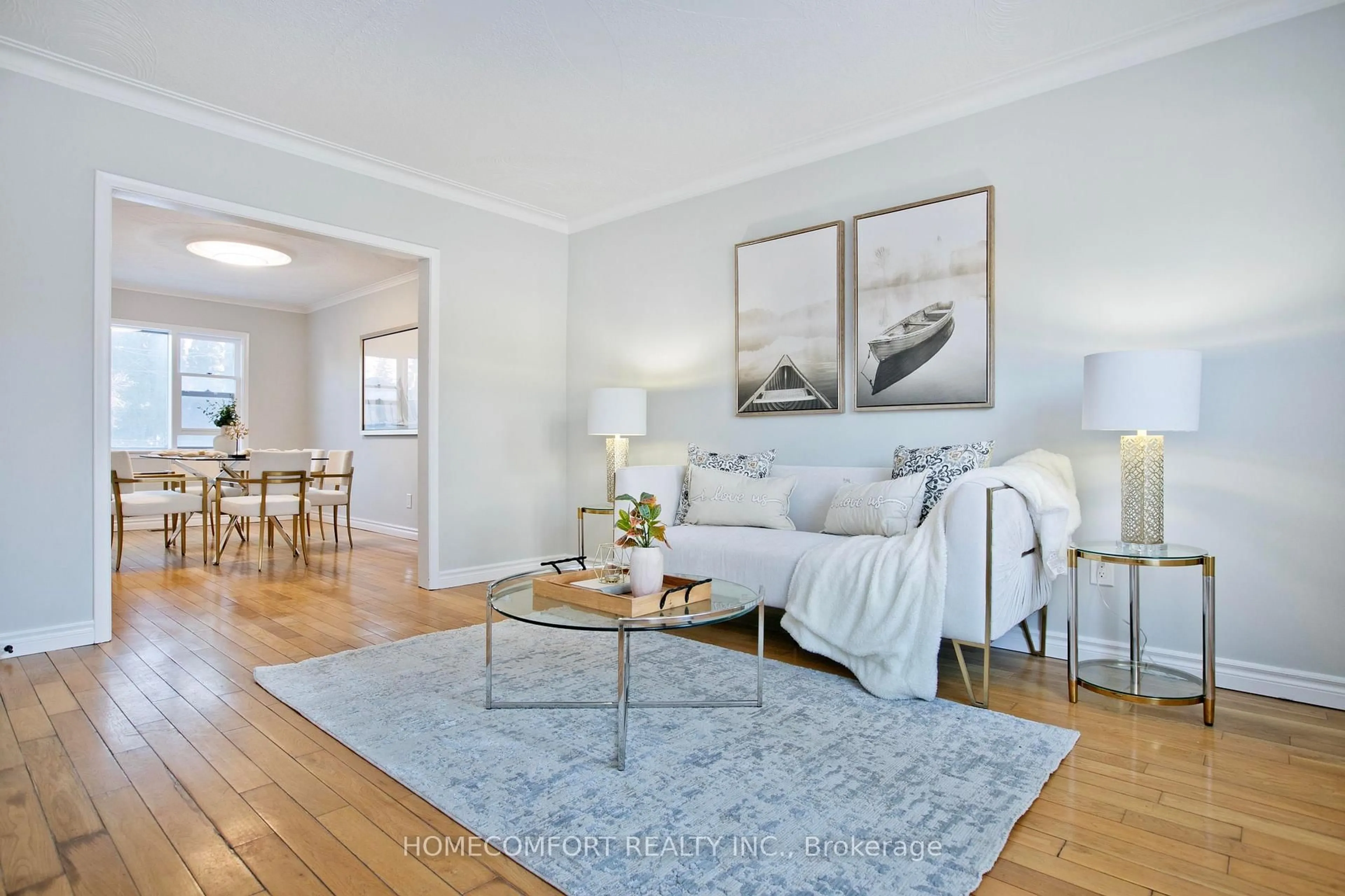 Living room with furniture, wood/laminate floor for 55 Lanark Ave, Toronto Ontario M6C 2B5