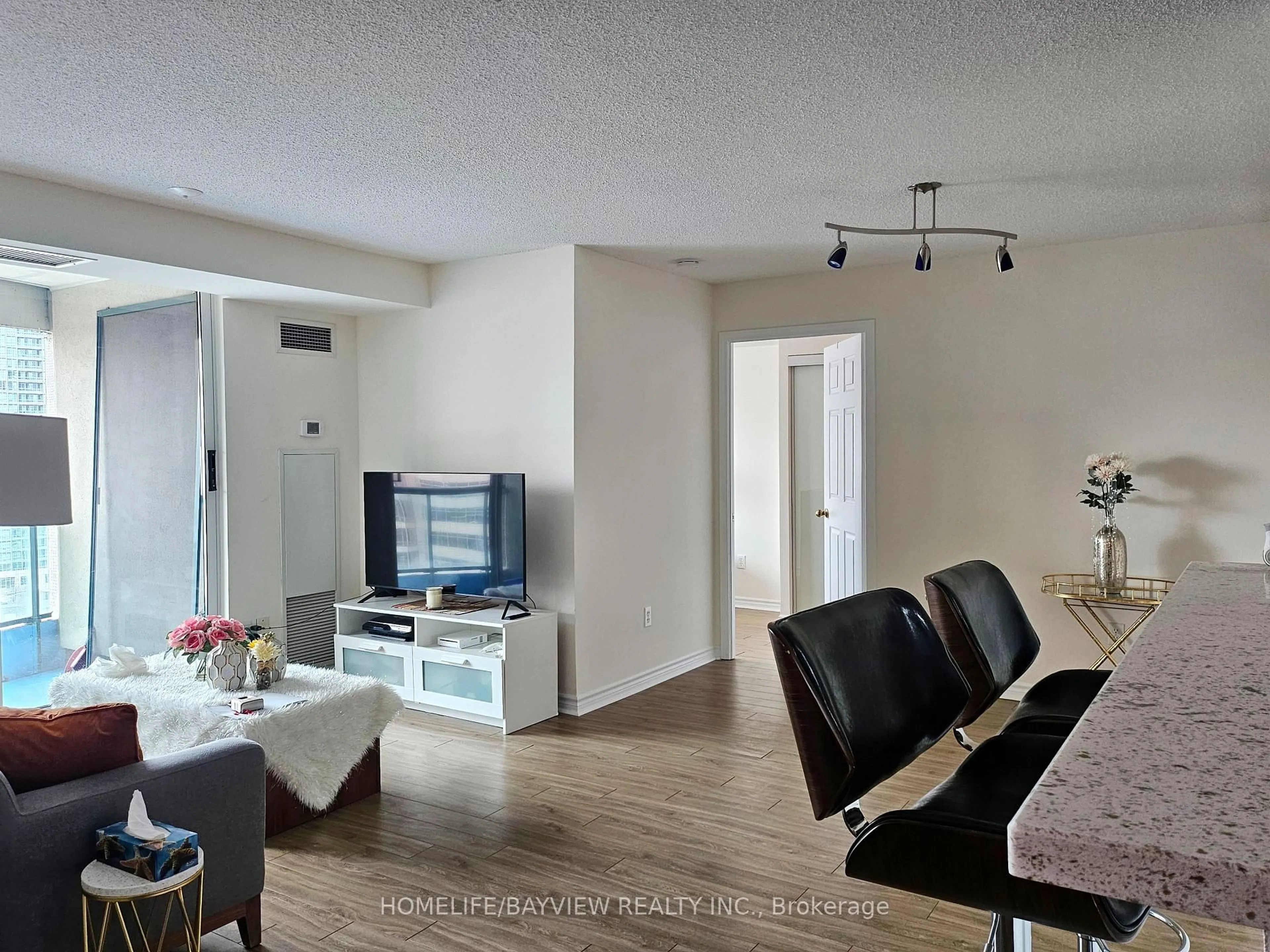 Living room with furniture, wood/laminate floor for 7 Lorraine Dr #1816, Toronto Ontario M2N 7H2