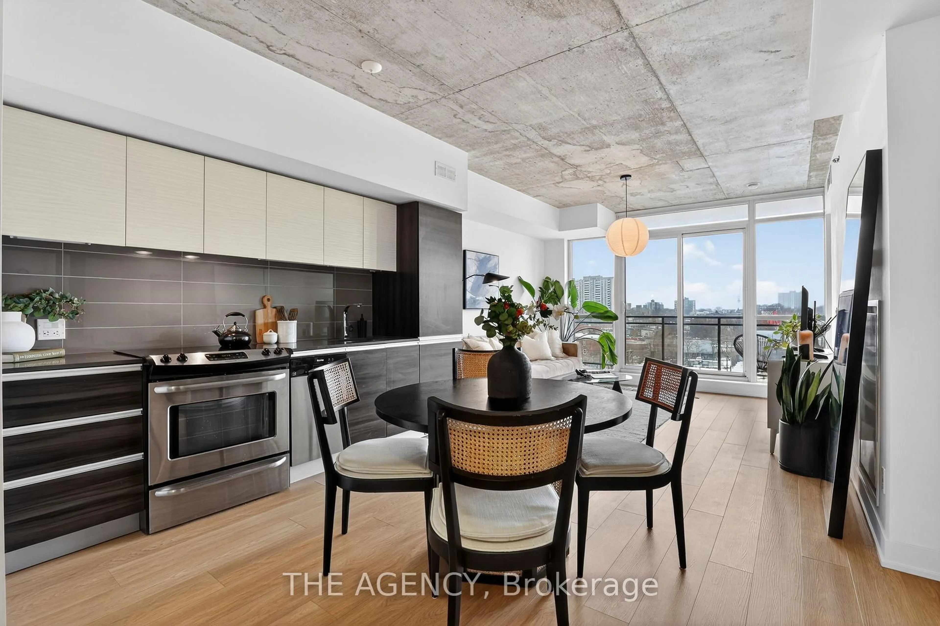 Open concept kitchen, cement floor for 20 Minowan Miikan Lane #710, Toronto Ontario M6J 0E5