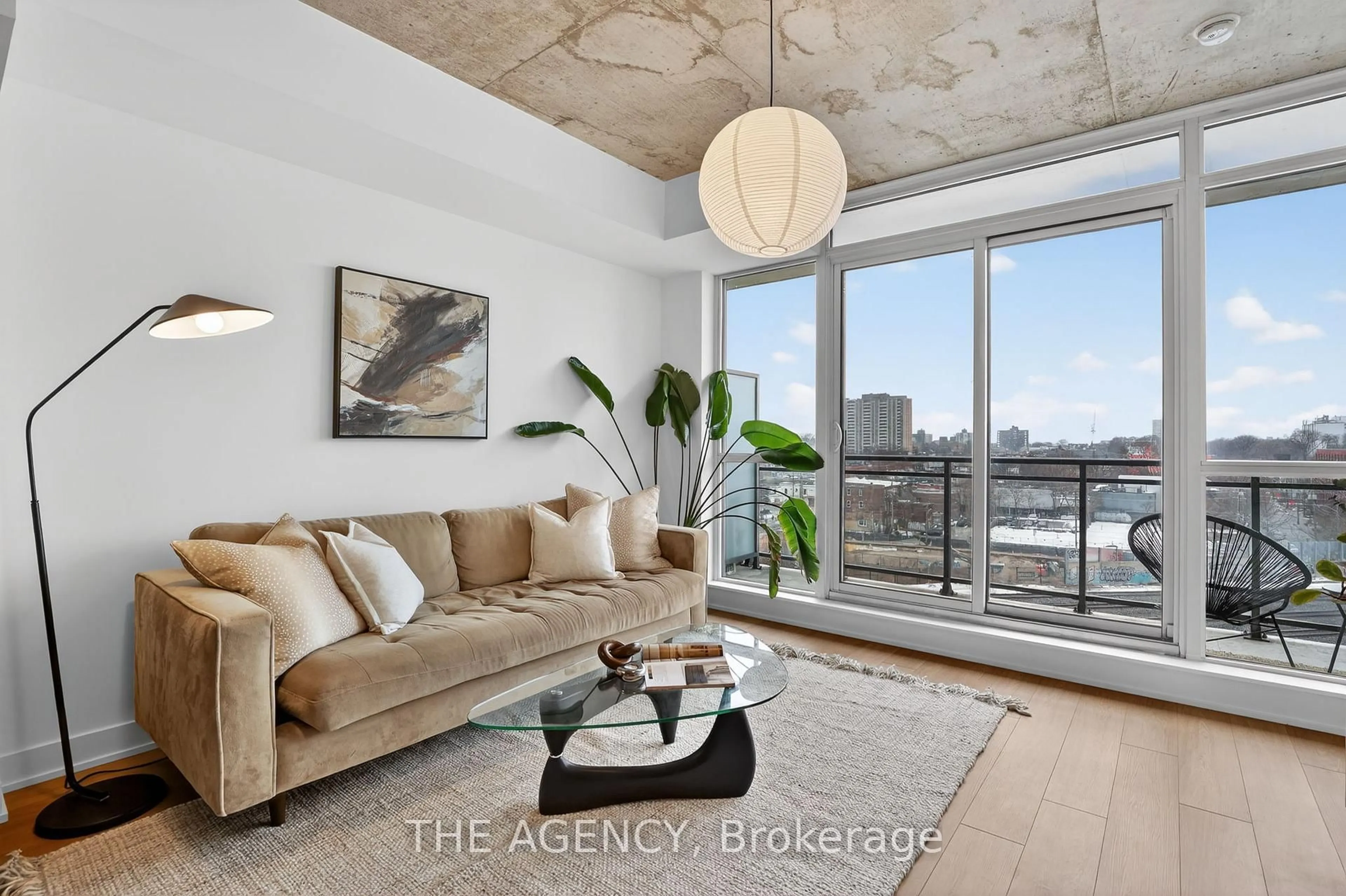 Living room with furniture, cement floor for 20 Minowan Miikan Lane #710, Toronto Ontario M6J 0E5