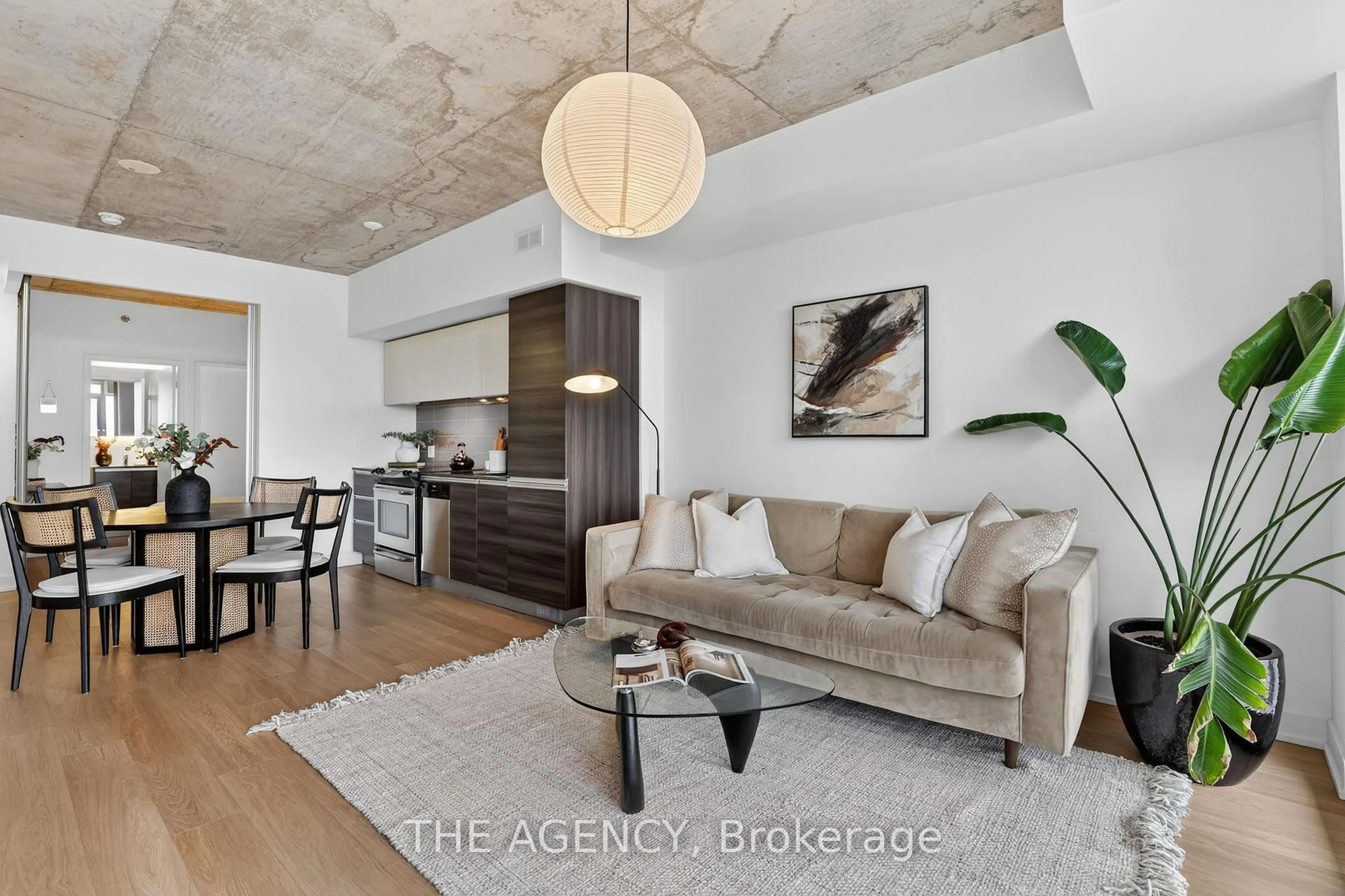 Living room with furniture, cement floor for 20 Minowan Miikan Lane #710, Toronto Ontario M6J 0E5