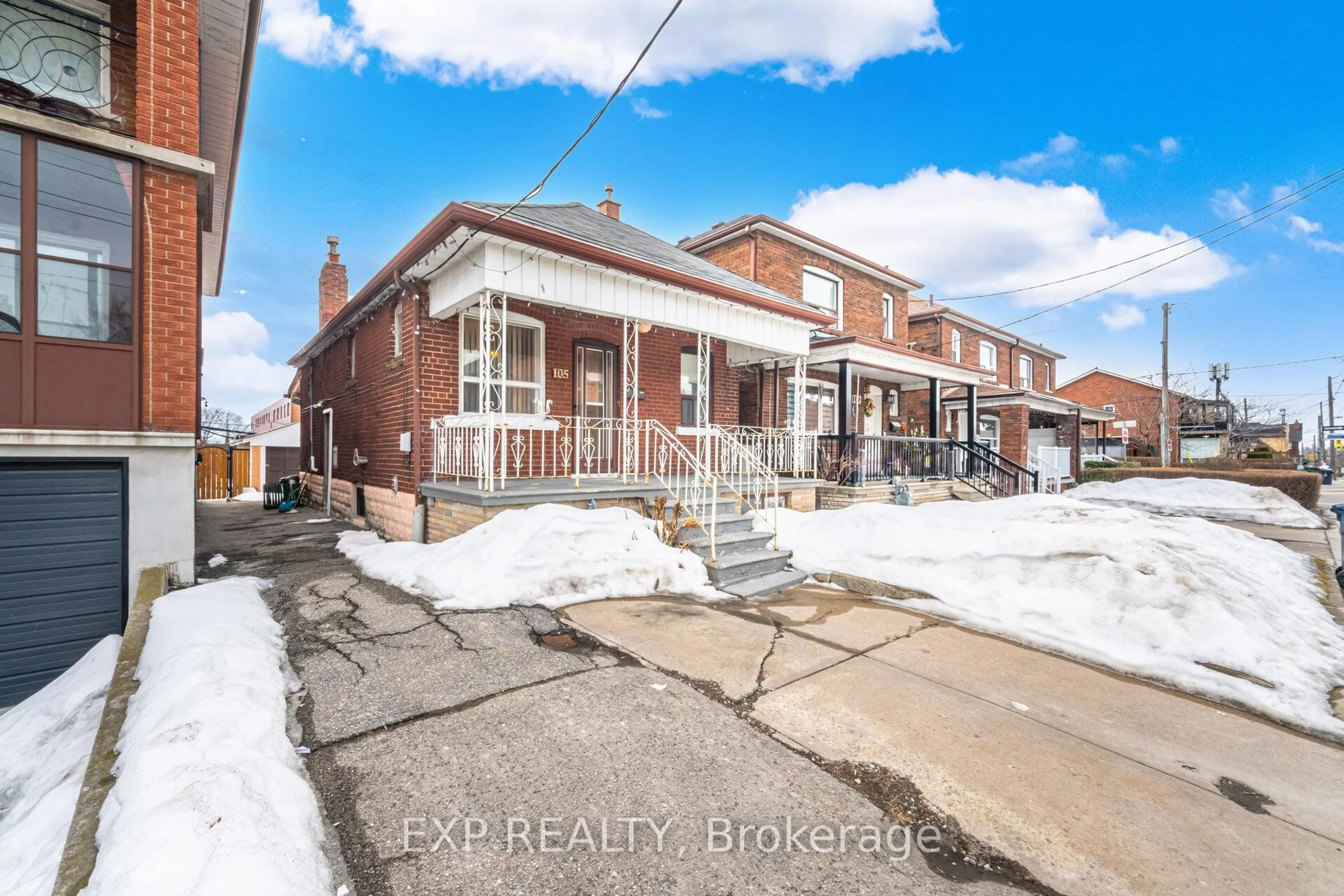 Home with brick exterior material, street for 105 Rogers Rd, Toronto Ontario M6E 1P4