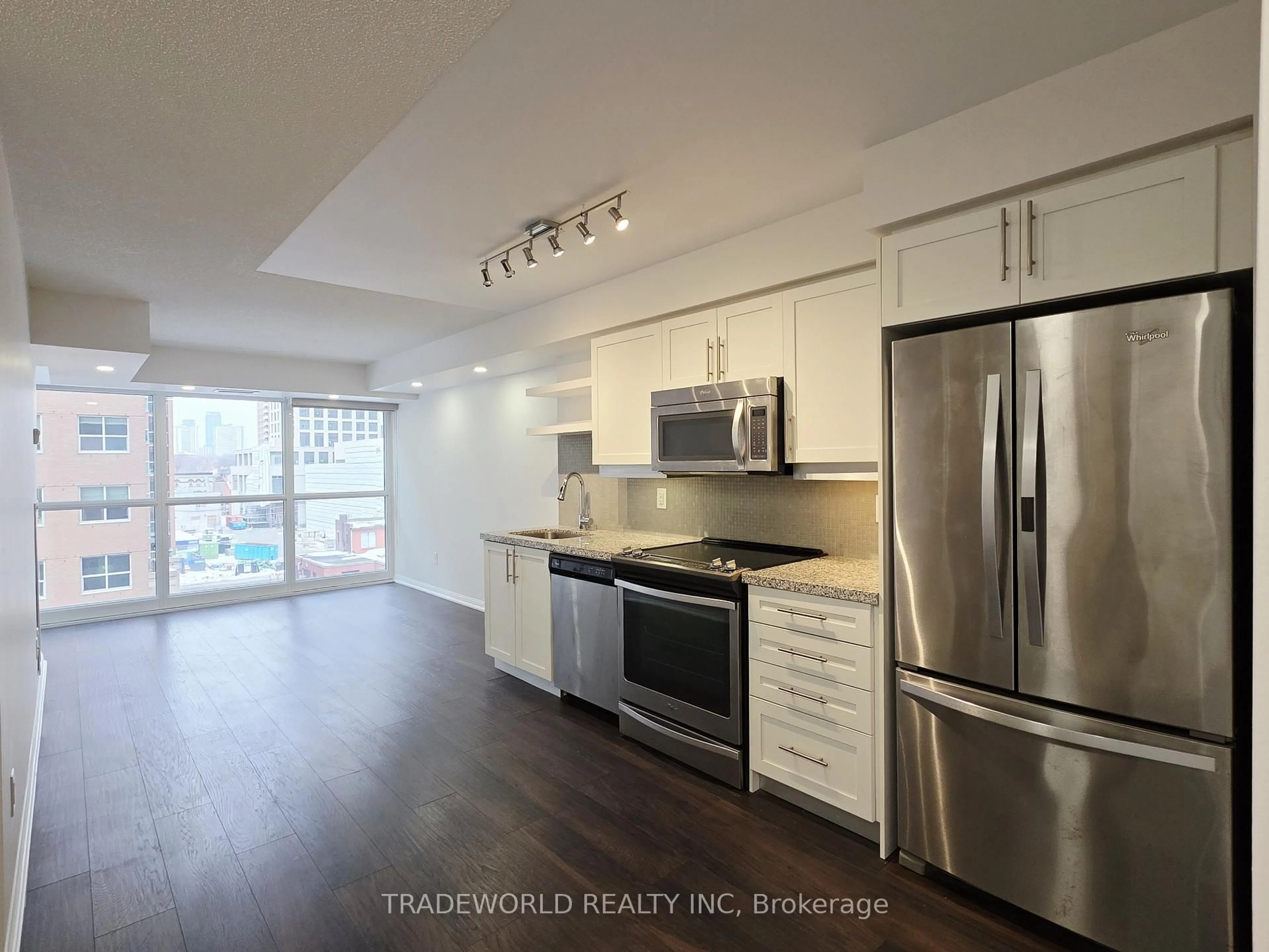 Open concept kitchen, wood/laminate floor for 400 Adelaide St #713, Toronto Ontario M5A 4S3